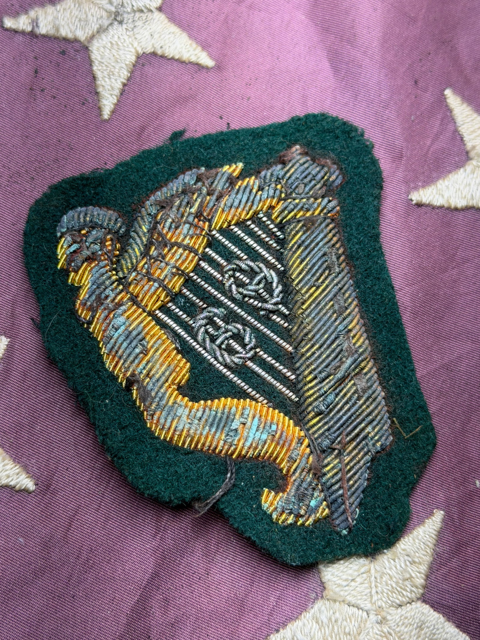 CIVIL WAR 69TH IRISH BRIGADE BULLION CLOTH BADGE BY JOHN A. BAKER: CIVIL WAR 69TH IRISH BRIGADE BULLION CLOTH BADGE BY JOHN A. BAKER. The badge in question is a bullion?embroidered insignia attributed to the elite 69th Infantry Regiment (New York) of the famed Irish 