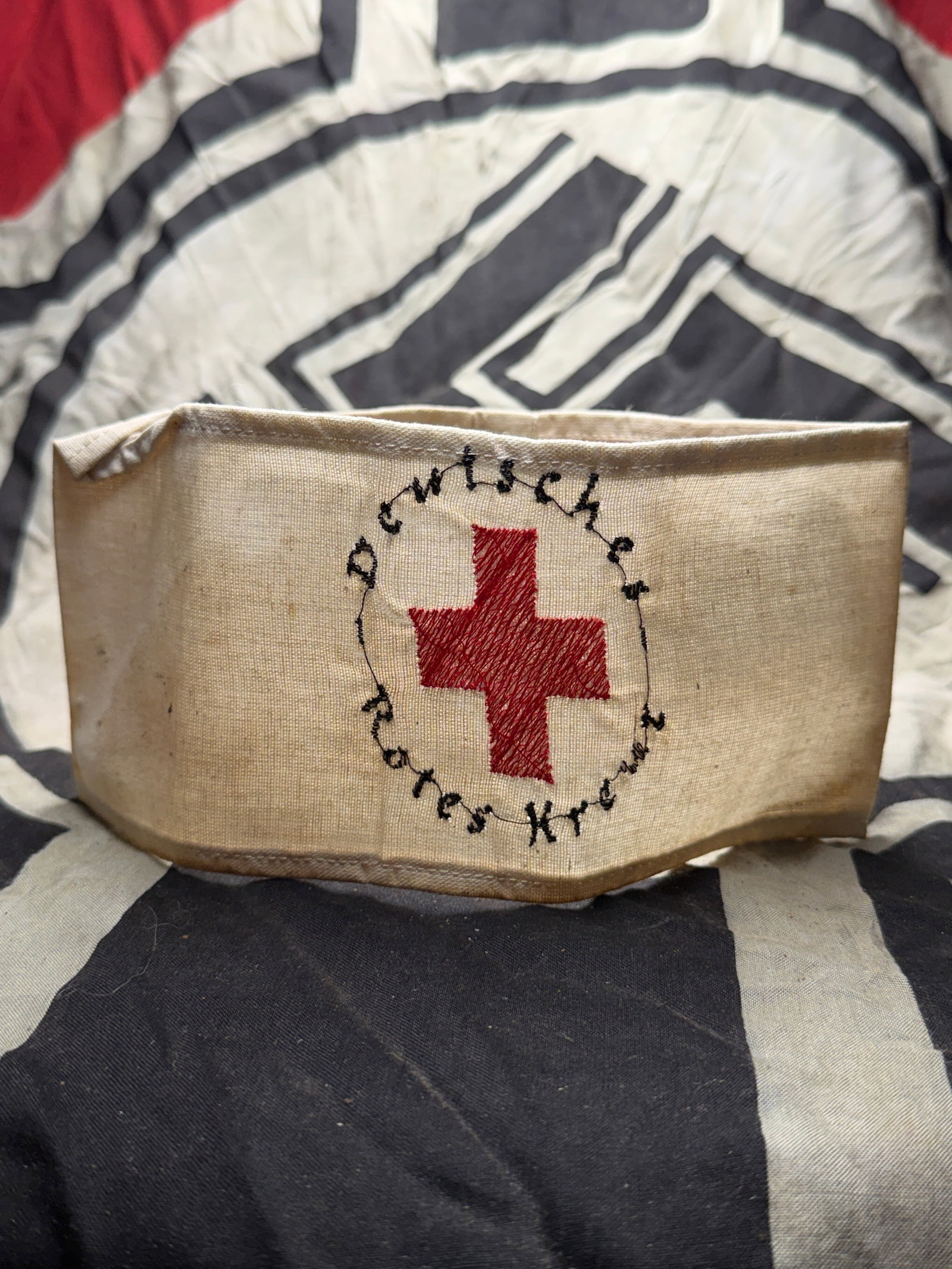 WW2 DRK Deutsches Rotes Kreuz RED CROSS Armband: WW2 DRK Deutsches Rotes Kreuz RED CROSS Armband. An ultra rare find. Armband shows light discoloration and some staining. DRK brooch finish is worn. Please view all detailed pictures. A scarce example