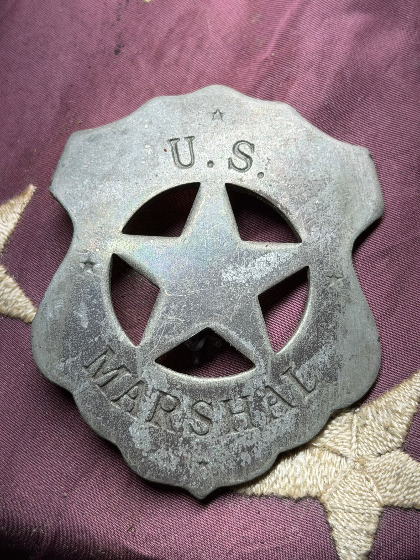 RARE 1800'S U.S. MARSHAL BADGE: RARE 1800'S U.S. MARSHAL BADGE. 6-point star cutout within a shield outline — a classic “tin star” marshal badge pattern. Appears to be nickel-silver or pewter alloy, hand-cut or cast. Singl