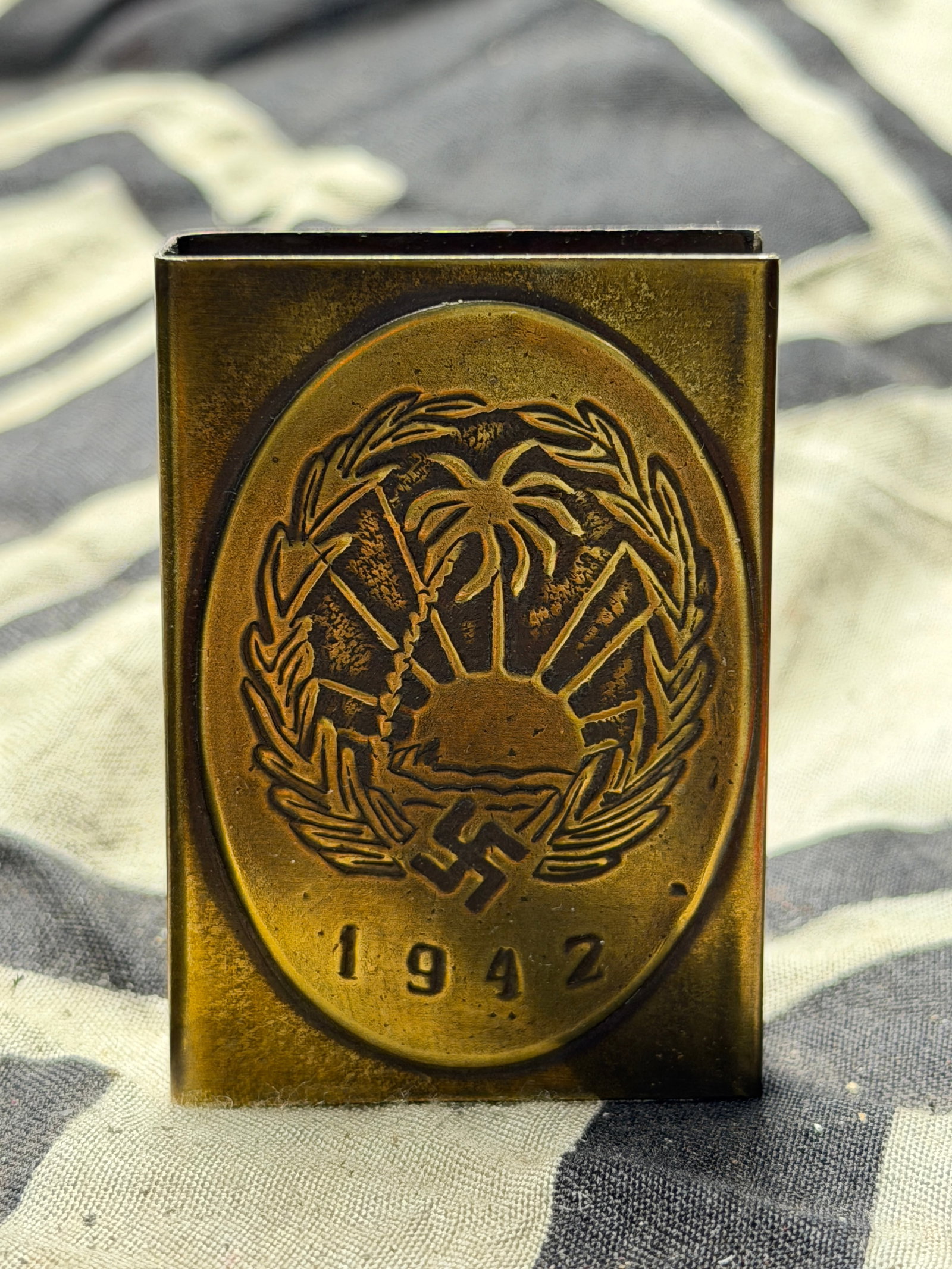 WWII GERMAN BRASS DAK AFRIKA KORP TRENCH ART MATCHSAFE: WWII GERMAN BRASS DAK AFRIKA KORP TRENCH ART MATCHSAFE. A VERY RARE FIND. SHOWS GOOD WEAR AND USE WITH A BEAUTIFUL OVERALL PATINA. PLEASE VIEW ALL DETAILED PICTURES. A RARE EXAMPLE OF THE TIME PERIOD.