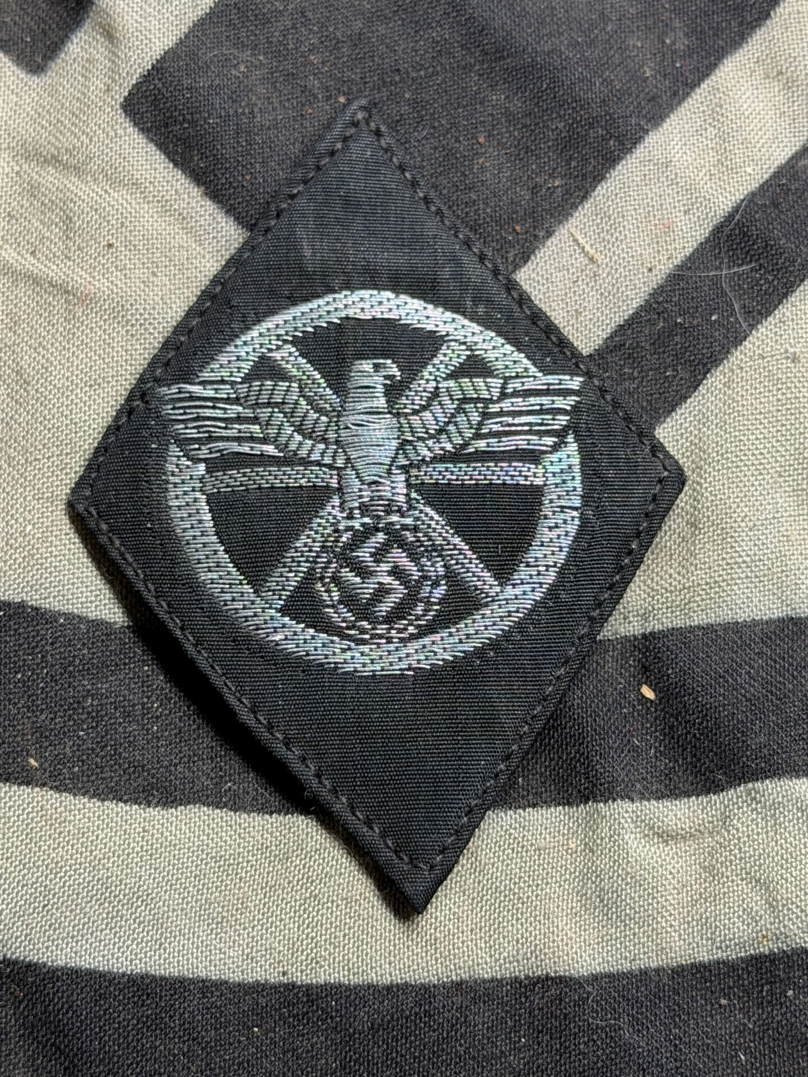 German NSDAP (NAZI PARTY) NSKK SECOND PATTERN DRIVER’S SLEEVE DIAMOND WITH RZM PAPER TAG: German NSDAP (NAZI PARTY) NSKK SECOND PATTERN DRIVER’S SLEEVE DIAMOND WITH RZM PAPER TAG. The development of the NSKK, “National Sozialistisches Kraftfahr Korps” (National Socialist Motor Co