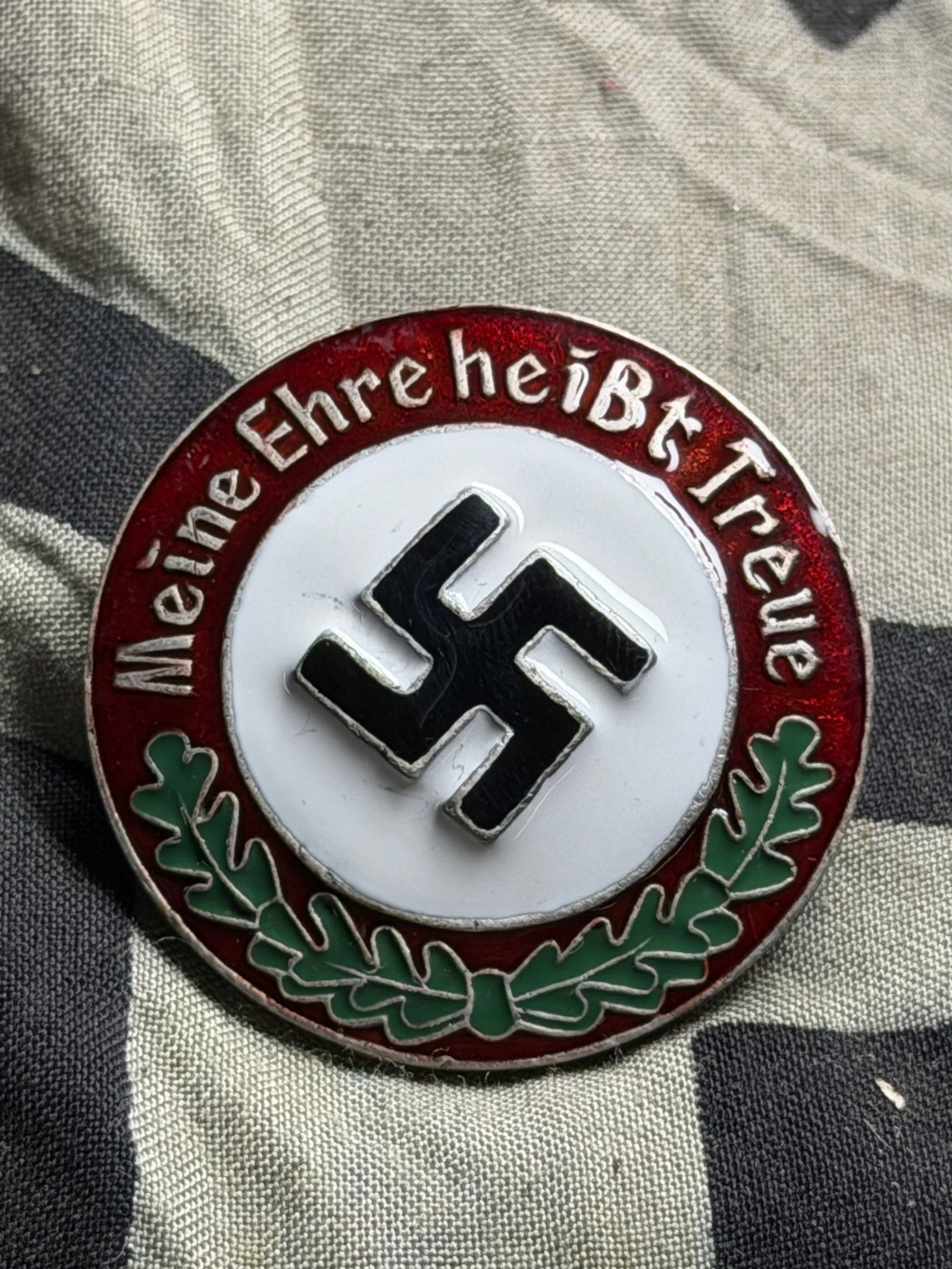 WW2 SS Badge - Meine Ehre heiBt Treue - Screw Back Marked Ges. Gesch. RZM SS: WW2 SS Badge - Meine Ehre heiBt Treue - Screw Back Marked Ges. Gesch. RZM SS. SHOWS GOOD WEAR AND USE WITH A BEAUTIFUL OVERALL PATINA. PLEASE VIEW ALL DETAILED PICTURES. A RARE EXAMPLE OF THE TIME PER