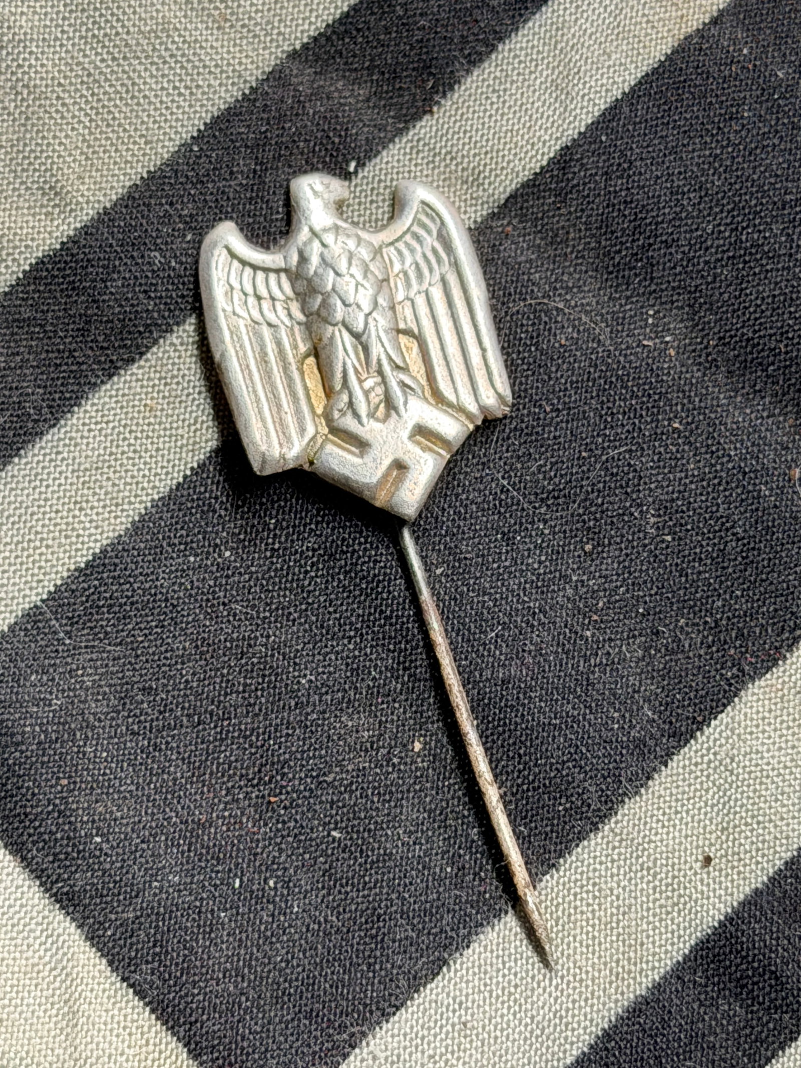 WW2 GERMAN WEHRMACHT EAGLE STICKPIN: WW2 GERMAN WEHRMACHT EAGLE STICKPIN. A RARE FIND. SHOWS GOOD WEAR AND USE WITH A BEAUTIFUL OVERALL PATINA. PLEASE VIEW ALL DETAILED PICTURES. A RARE EXAMPLE.