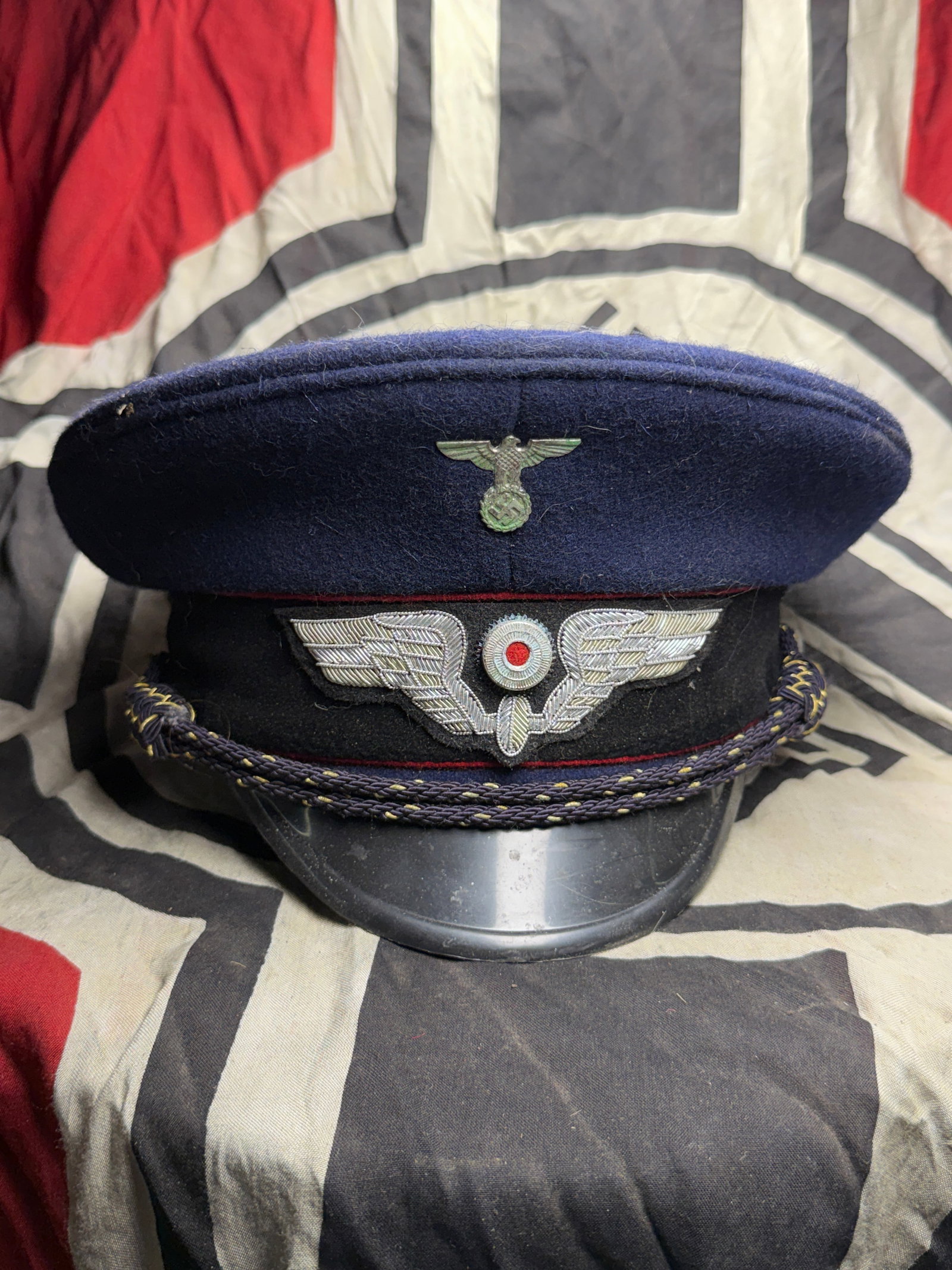 World War II–Era German State Railway (Deutsche Reichsbahn) Official’s Visor Cap: A regulation visor cap (Schirmmütze) worn by a uniformed official of the German State Railways (Deutsche Reichsbahn) during the period of the Second World War (1939–1945). The cap is constructed of