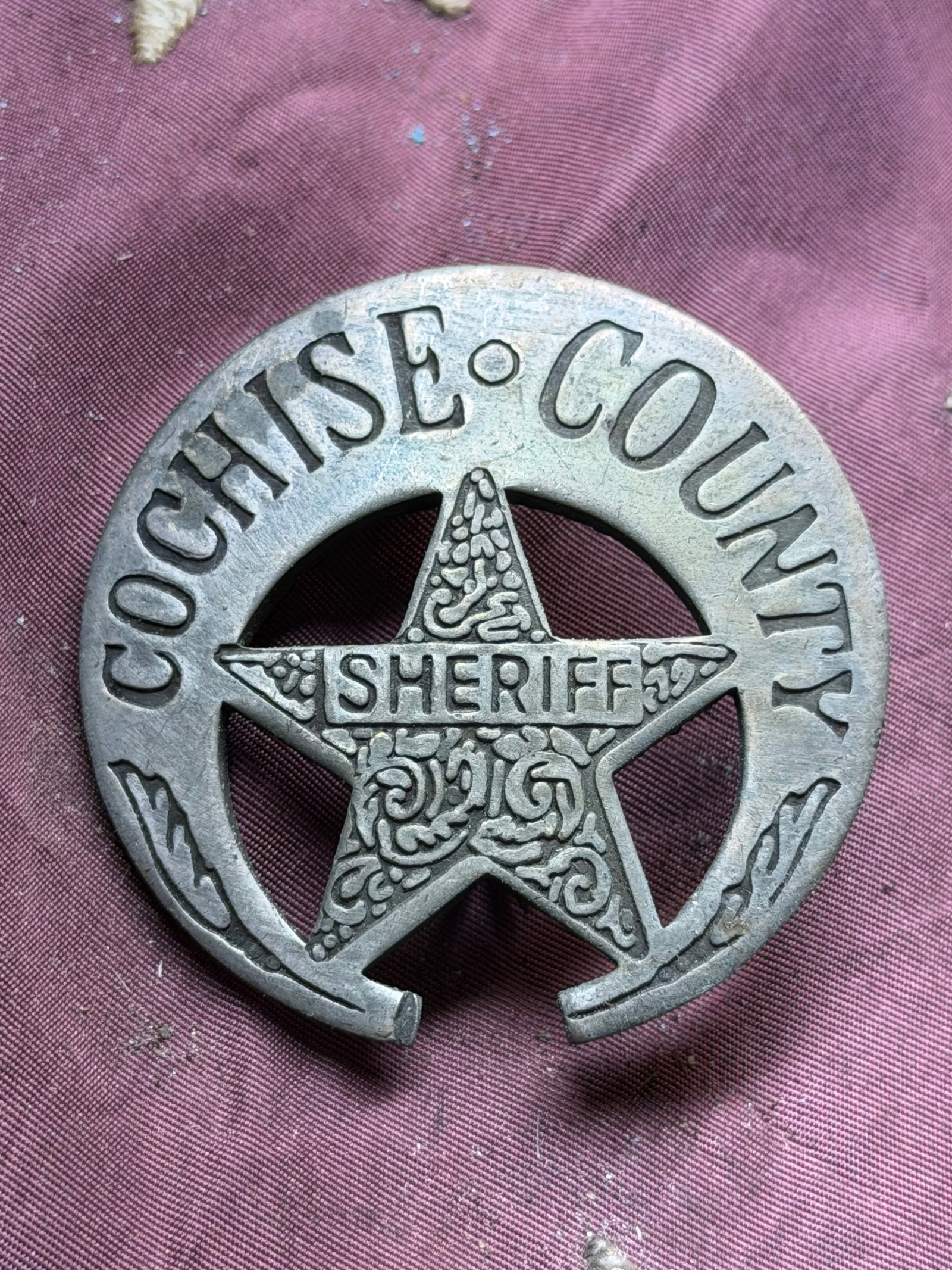 Cochise County Sheriff Badge — Early 20th Century: Cochise County Sheriff Badge — Early 20th Century. A circular five-pointed star badge marked “COCHISE COUNTY” around the perimeter and “SHERIFF” across a banner in the star’s cente
