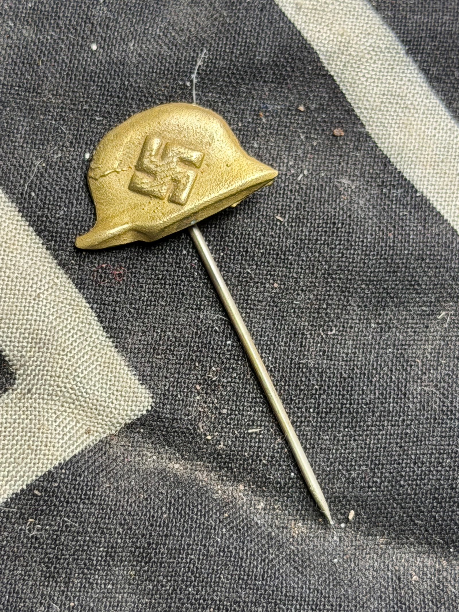 WW2 German Stickpin NSDAP Vet support: WW2 German Stickpin NSDAP Vet support. Stickpin NSDAP Vet support. Condition excellent. Gold finish with a bit of tarnish light on swastika. Not a common stick pin. Thought to be the NSKRB way of supp