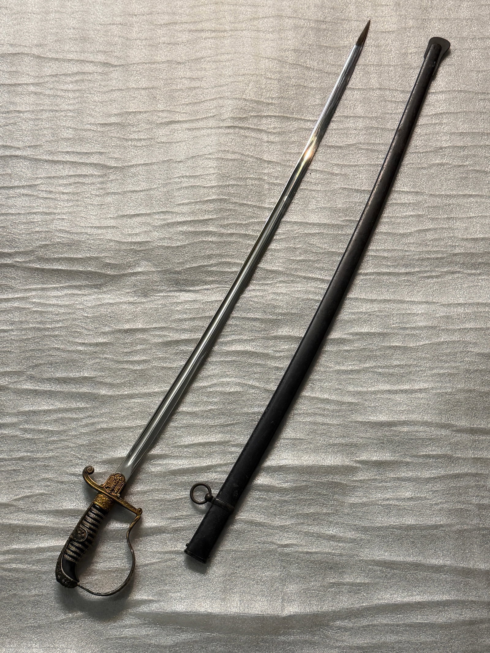 RARE WW2 GERMAN HEER OFFICER'S DRESS SWORD BY EICKHORN SOLINGEN WITH SCABBARD: RARE WW2 GERMAN HEER OFFICER'S DRESS SWORD BY EICKHORN SOLINGEN WITH SCABBARD. Identifiable by the ornate eagle-and-swastika emblem cast into the gilt crossguard and the black wire-wrapped grip. This 