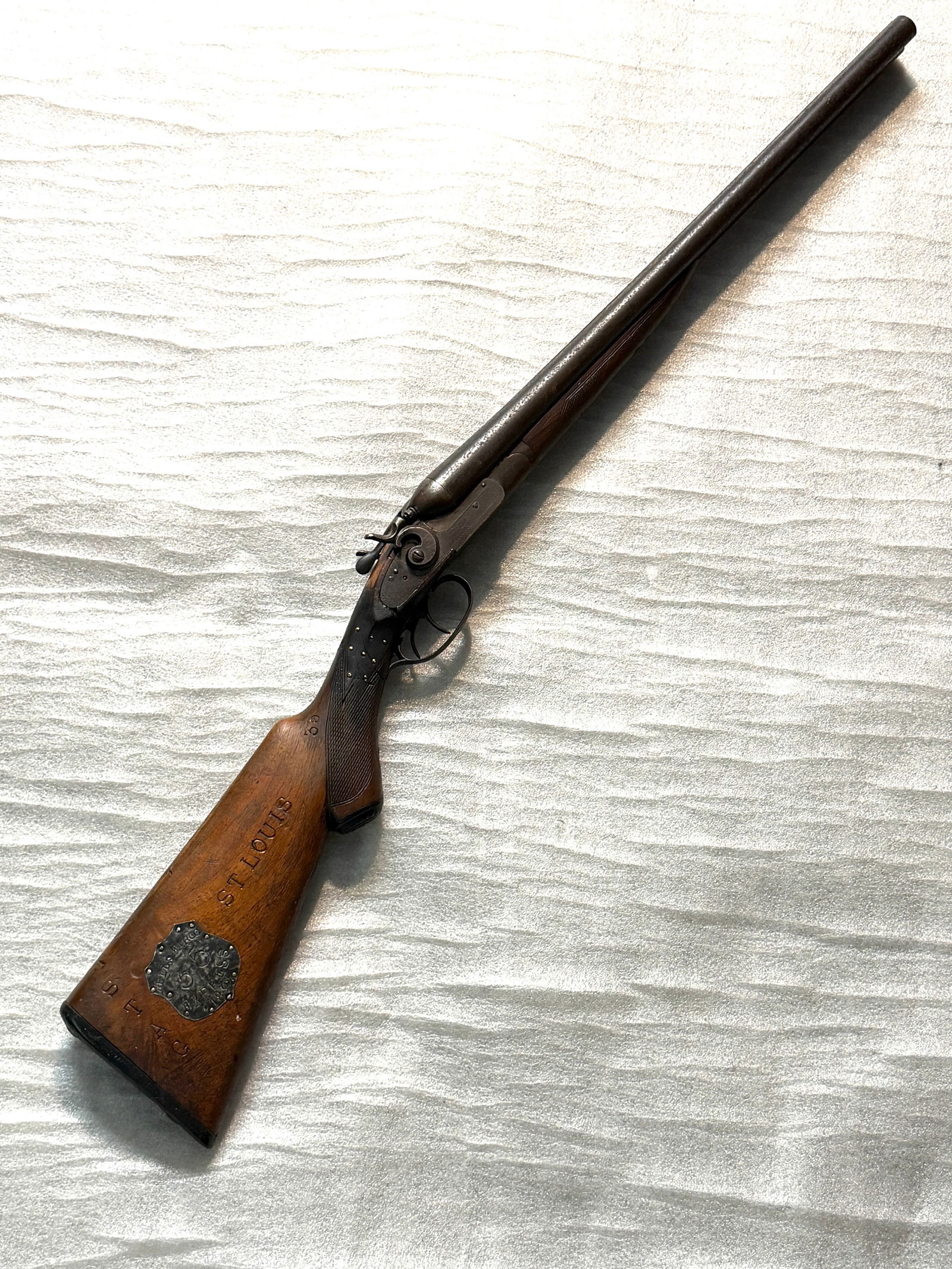 1892 Wells Fargo & Co. Express “Stage 35?? Double-Barrel Shotgun: Wells Fargo & Co. Express “Stage 35” Double-Barrel Shotgun (1892). This historic firearm is a 19th-century double-barrel shotgun manufactured by the Hartford Fire Arms Company, a period gunmak