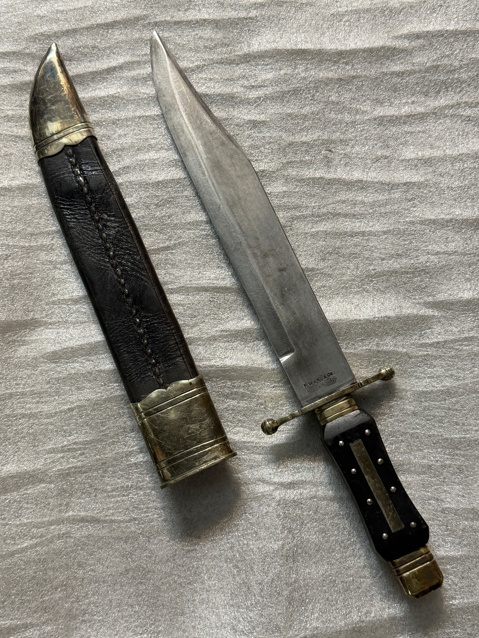 ANTIQUE 1800'S F. WARN & CO. SHEFFIELD (8) PIN HORN HANDLE BOWIE KNIFE: ANTIQUE 1800'S F. WARN & CO. SHEFFIELD (8) PIN HORN HANDLE BOWIE KNIFE. Marked "F. WARN & CO SHEFFIELD" on the blade. This is a British-made knife/dagger from Sheffield, England. The handles have blac