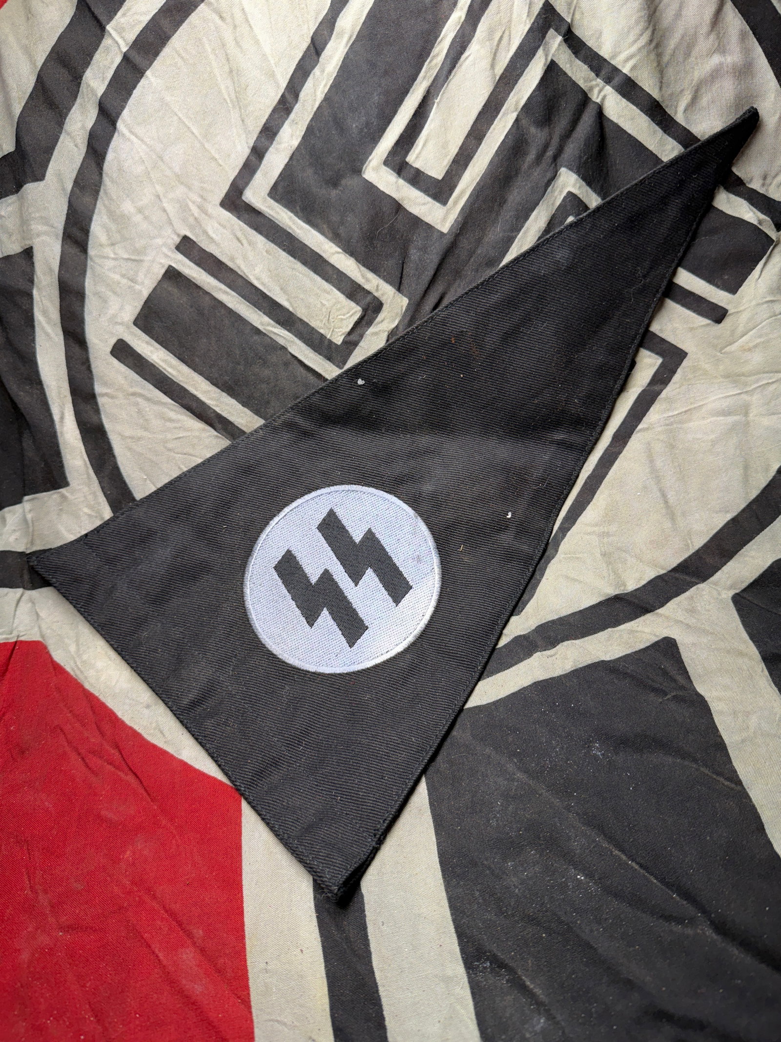 WW2 German Schutzstaffel (SS) Pennant circa 1930s–1945: WW2 German Schutzstaffel (SS) Pennant circa 1930s–1945. This triangular black cloth pennant, measuring approximately 11 inches in length, bears the double lightning-bolt insignia of the Schutzstaffe
