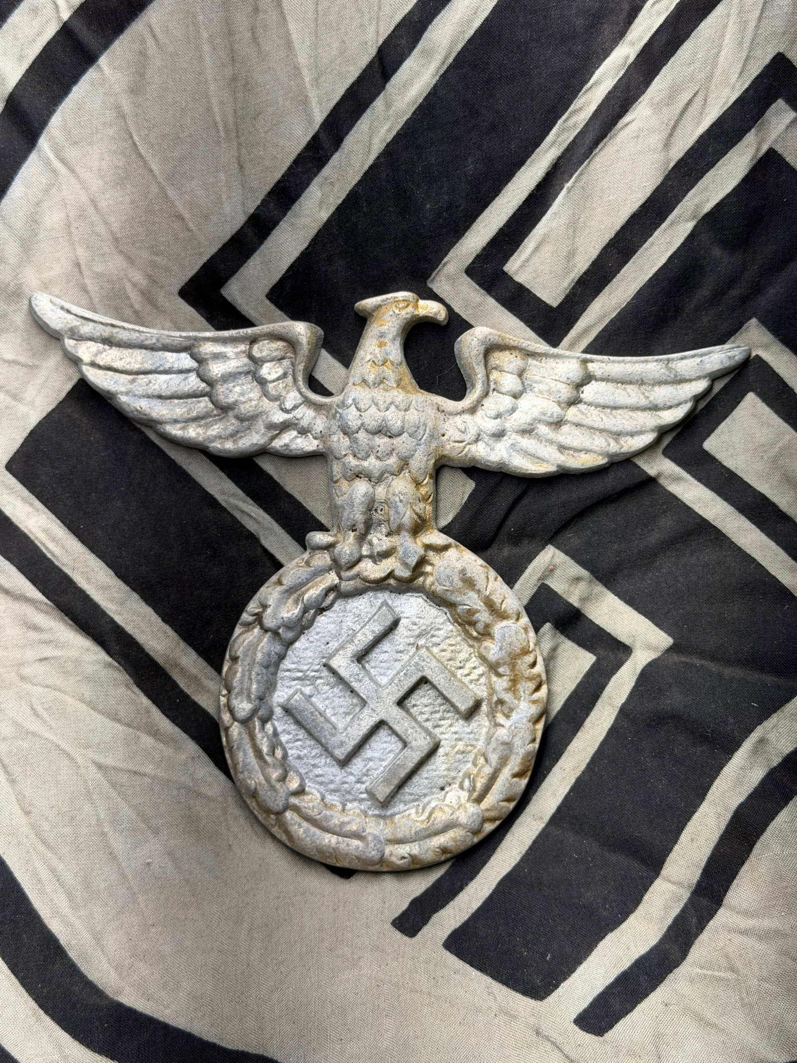 WW2 German Reichsadler (National Eagle Emblem) Plaque — Circa 1936–1945: WW2 German Reichsadler (National Eagle Emblem) Plaque — Circa 1936–1945. This cast metal plaque, measuring approximately 7 inches in height and 11 inches in wingspan, depicts the Reichsadler, or �