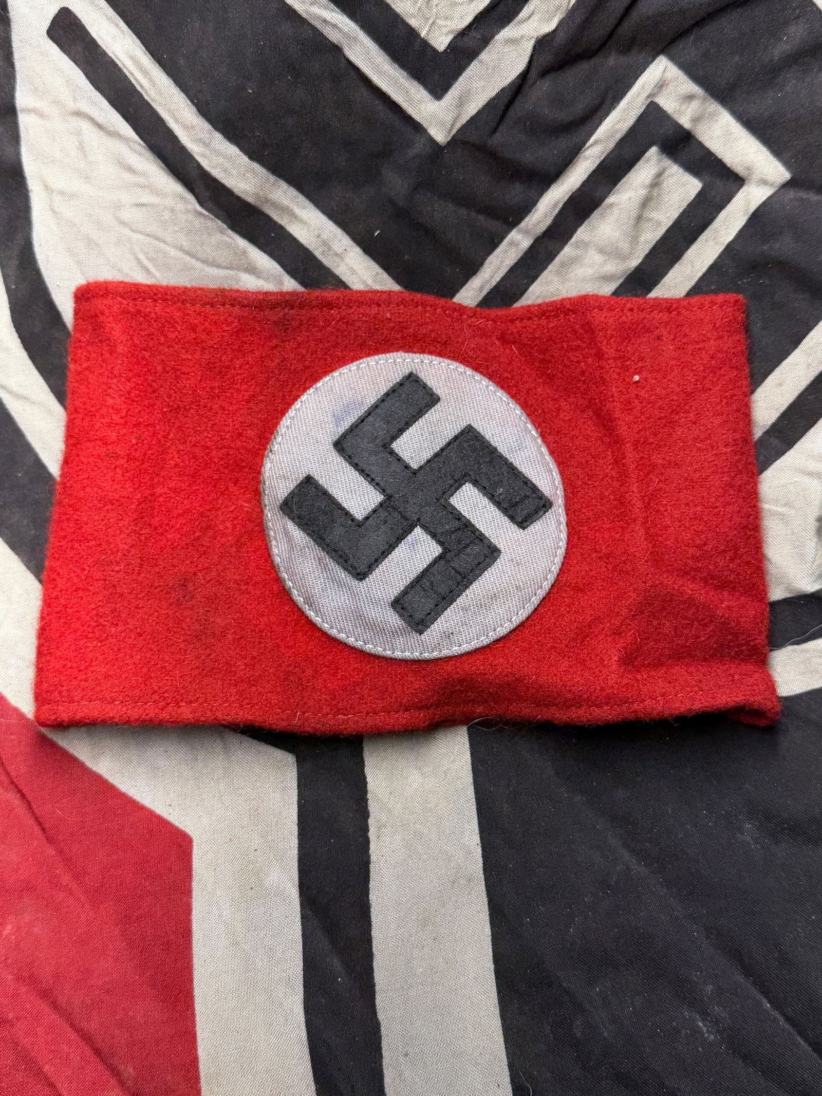 WW2 German National Socialist Armband (NSDAP Party Armband) circa 1933–1945 With RZM Paper Tag: WW2 German National Socialist Armband (NSDAP Party Armband) circa 1933–1945 With RZM Paper Tag. This red wool armband, featuring a white circular field with a black swastika, was worn by members of