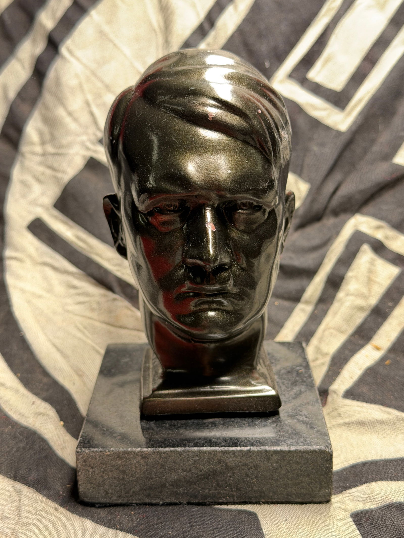Rare WW2 German Adolf Hitler Bust On Marble Base: Rare WW2 German Adolf Hitler Bust On Marble Base. This small cast-metal bust represents an example of propaganda art produced in Nazi Germany between the mid-1930s and 1940s. Such sculptures were crea