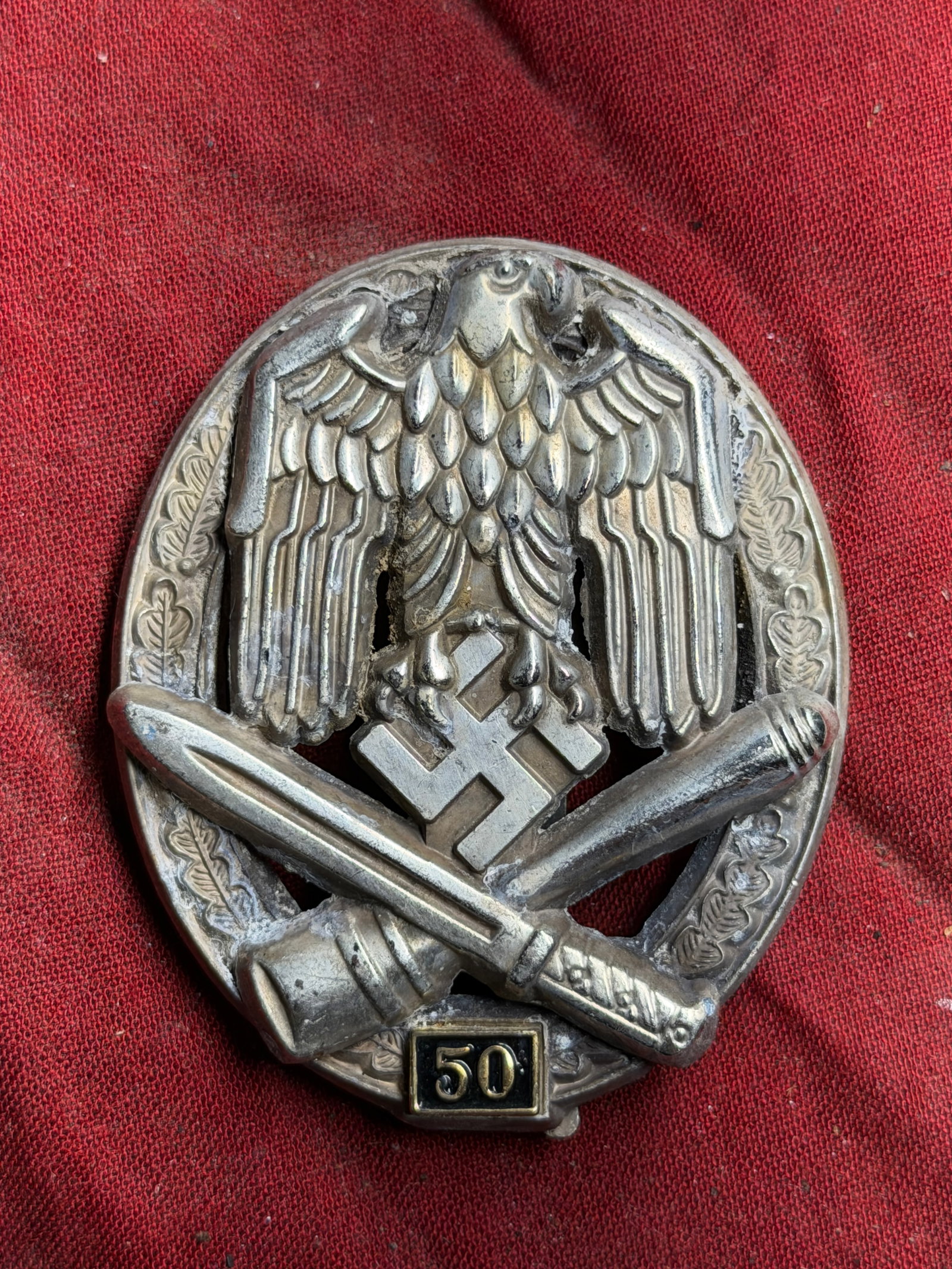 WW2 German General Assault Badge in Silver, Grade “50 Engagements?? By Josef Feix & Sohn: WW2 German General Assault Badge in Silver, Grade “50 Engagements” By Josef Feix & Sohn. The design features a German eagle clutching a swastika, superimposed over a crossed stick grenade and 