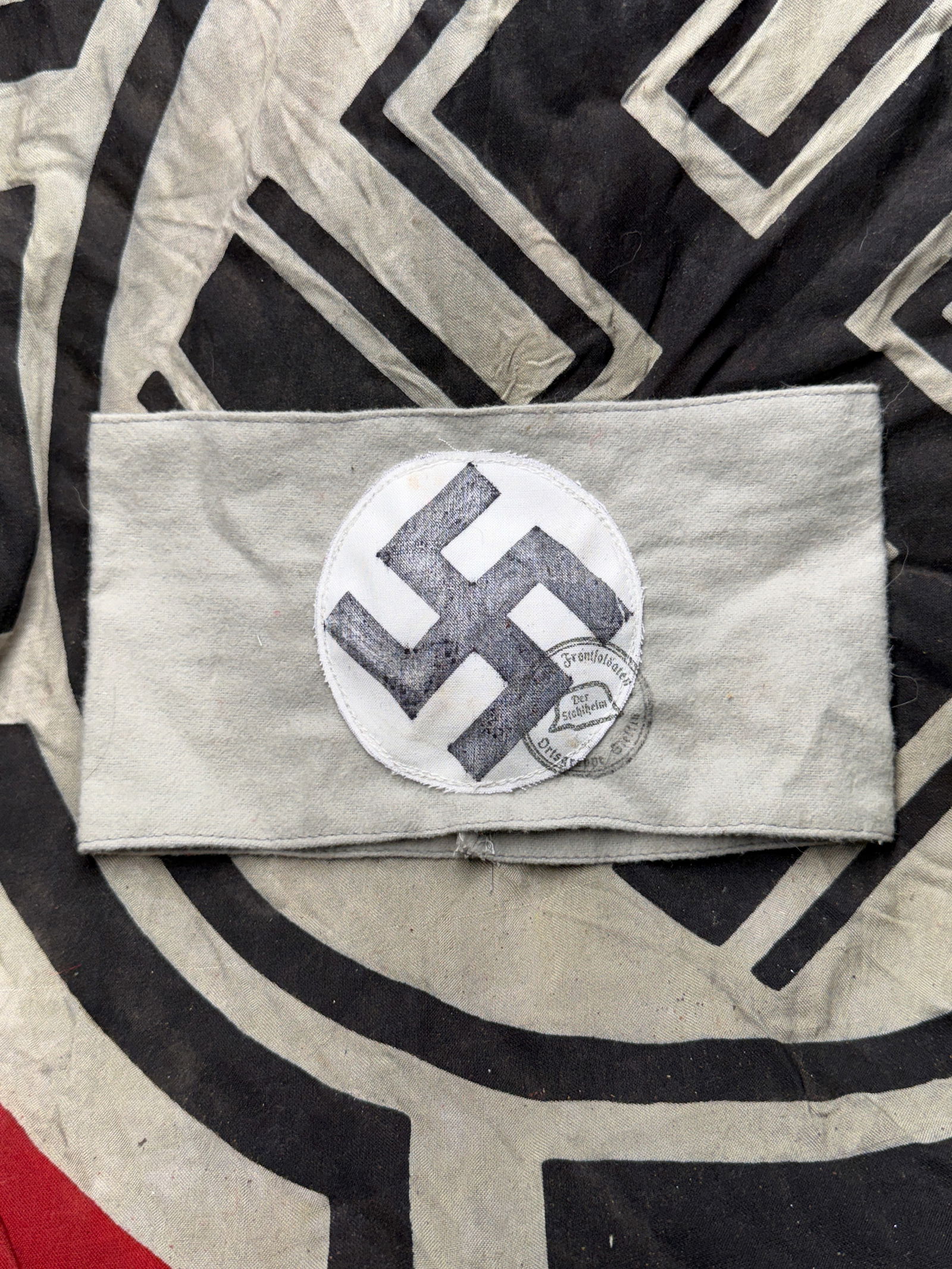 WW2 German Armband (Frontkämpferbund / Early National Socialist Era), circa 1930s: WW2 German Armband (Frontkämpferbund / Early National Socialist Era), circa 1930s. This cotton armband, measuring approximately 4 inches (10 cm) in height, features a black printed symbol on a white