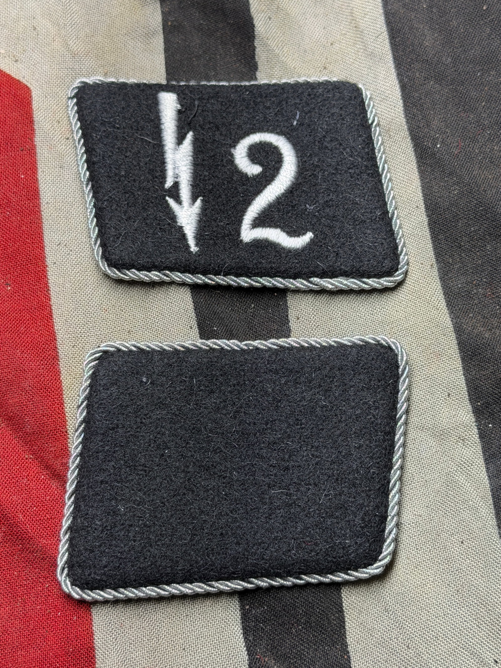 WW2 German Waffen-SS Collar Tabs — 2nd SS Panzer Division “Das Reich,?? circa 1940–1945: These artifacts are a pair of Waffen-SS collar tabs worn by members of the 2nd SS Panzer Division “Das Reich,” one of the most infamous formations of Nazi Germany’s Waffen-SS. The right-hand