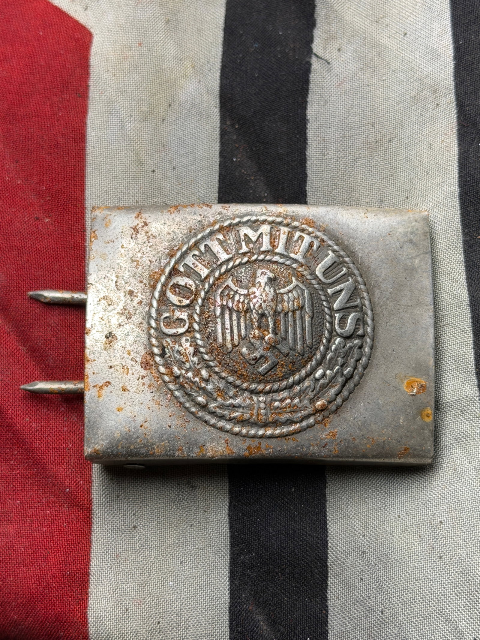 WW2 German Wehrmacht Enlisted Belt Buckle “Gott Mit Uns?? (God With Us) - Maker Marked: This artifact is a German Wehrmacht (Armed Forces) enlisted man’s belt buckle from the Second World War, bearing the national emblem of Nazi Germany. The buckle is constructed from stamped steel wit
