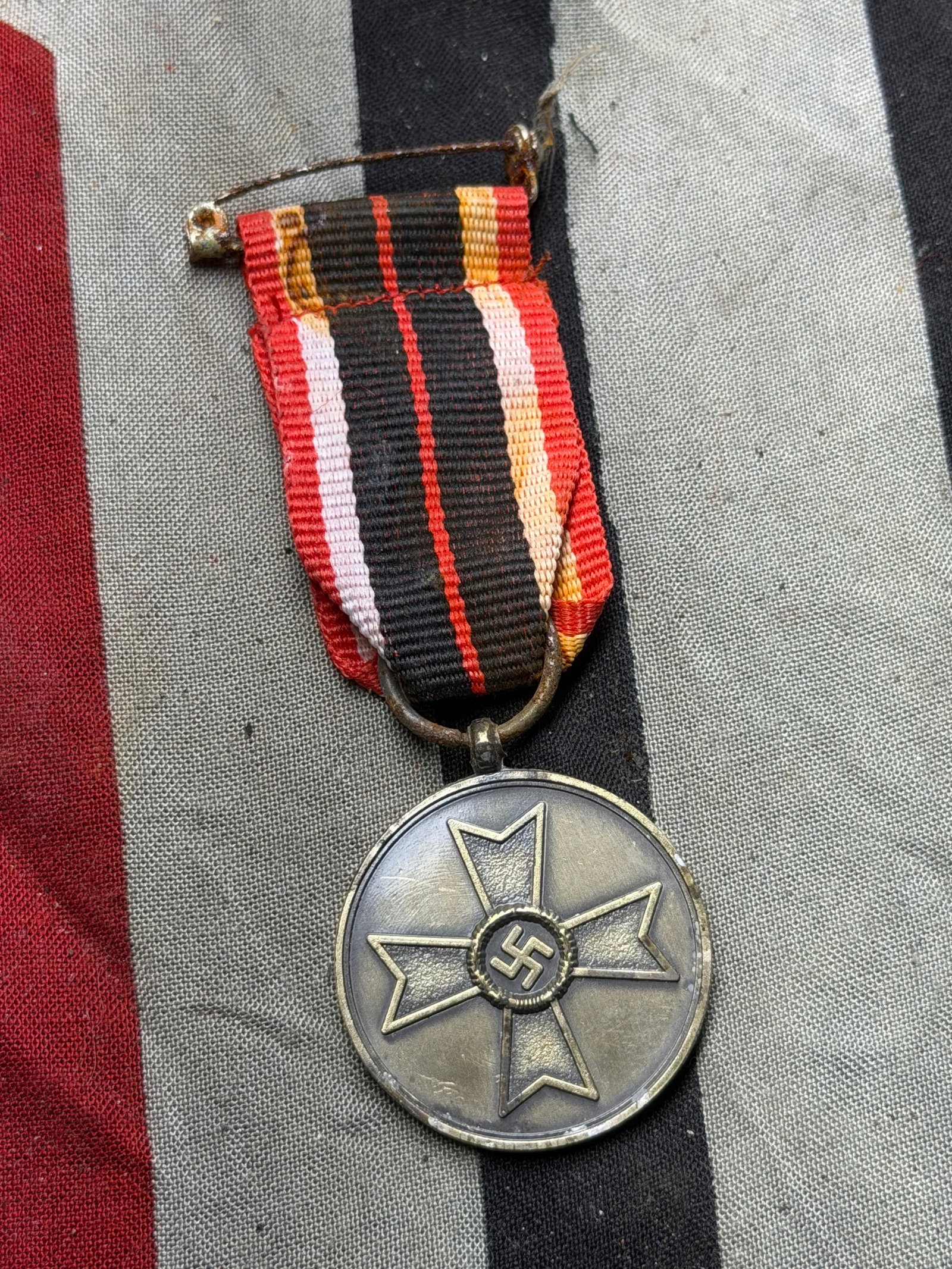 WW2 German War Merit Medal (Kriegsverdienstmedaille): This medal is the War Merit Medal (Kriegsverdienstmedaille), instituted on October 19, 1939, by Adolf Hitler to recognize non-combatant service to the German war effort during the Second World War. It