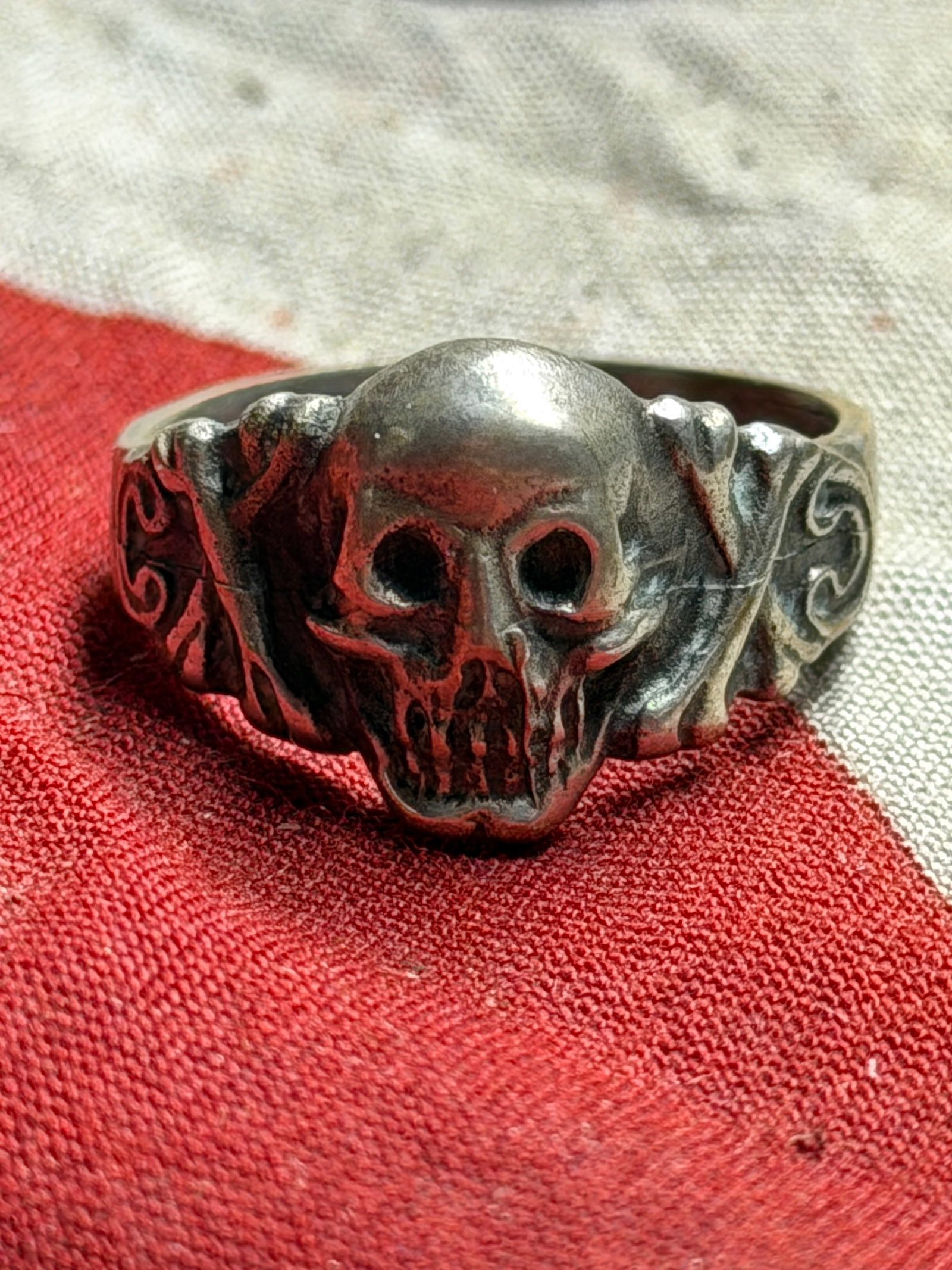 WWII German Skull SS Ring – 835 Silver Totenkopf Soldier Worn: Presented here is an original WWII-era German Skull (Totenkopf) ring, crafted in .835 silver and featuring a bold, high-relief skull motif. The skull design, symbolizing mortality and valor, is flanke