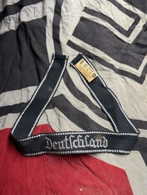 WW2 German Deutschland Cuff Title With RZM Paper Tag
