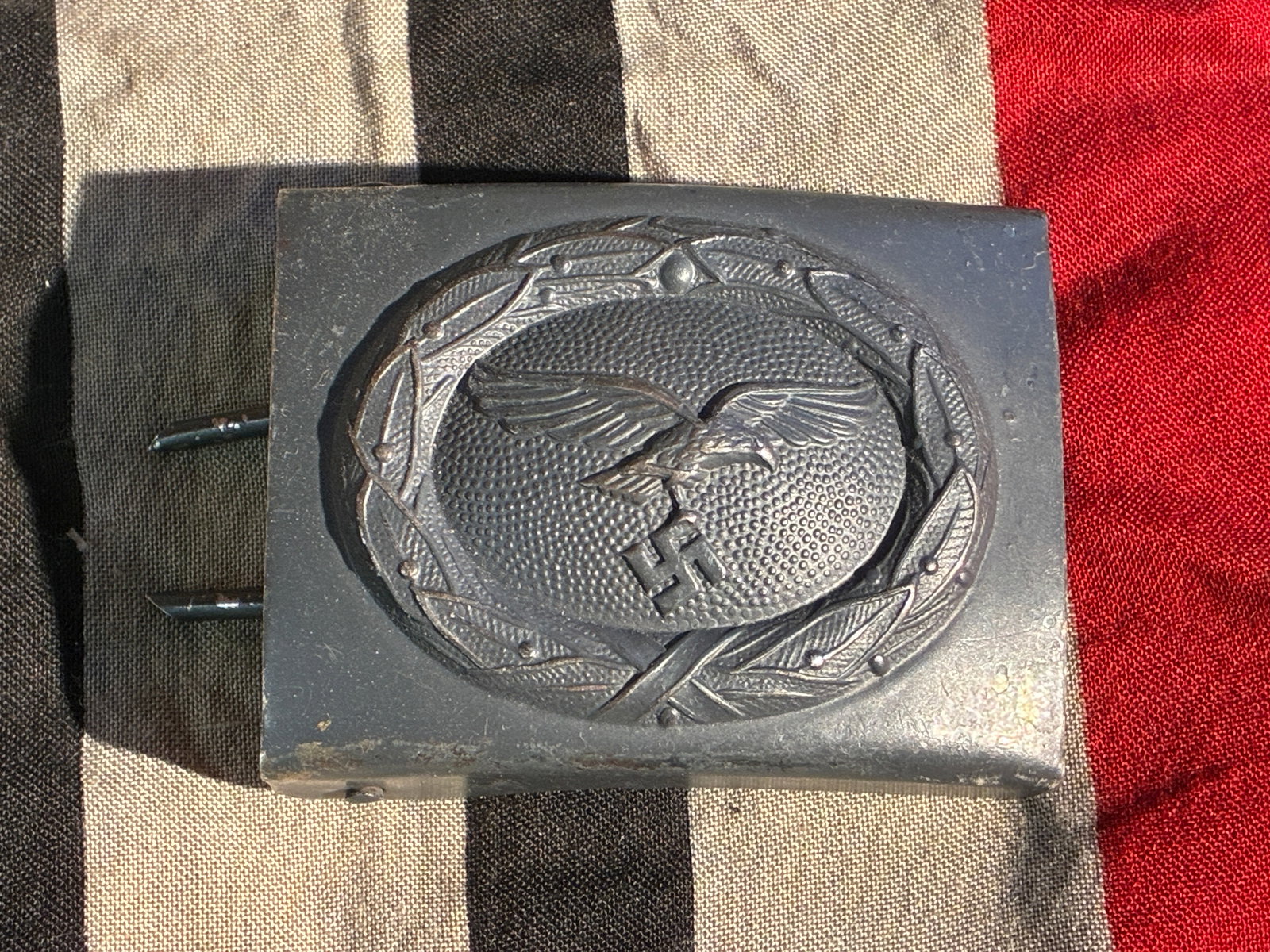 ca. 1935–1945 WW2 German Luftwaffe Enlisted Men’s Belt Buckle By D.C.F. & Co.: This steel belt buckle, manufactured by D.C.F. & Co., belonged to an enlisted member of the Luftwaffe, the air force of Nazi Germany. The front displays the Luftwaffe’s distinctive emblem: an eagle 