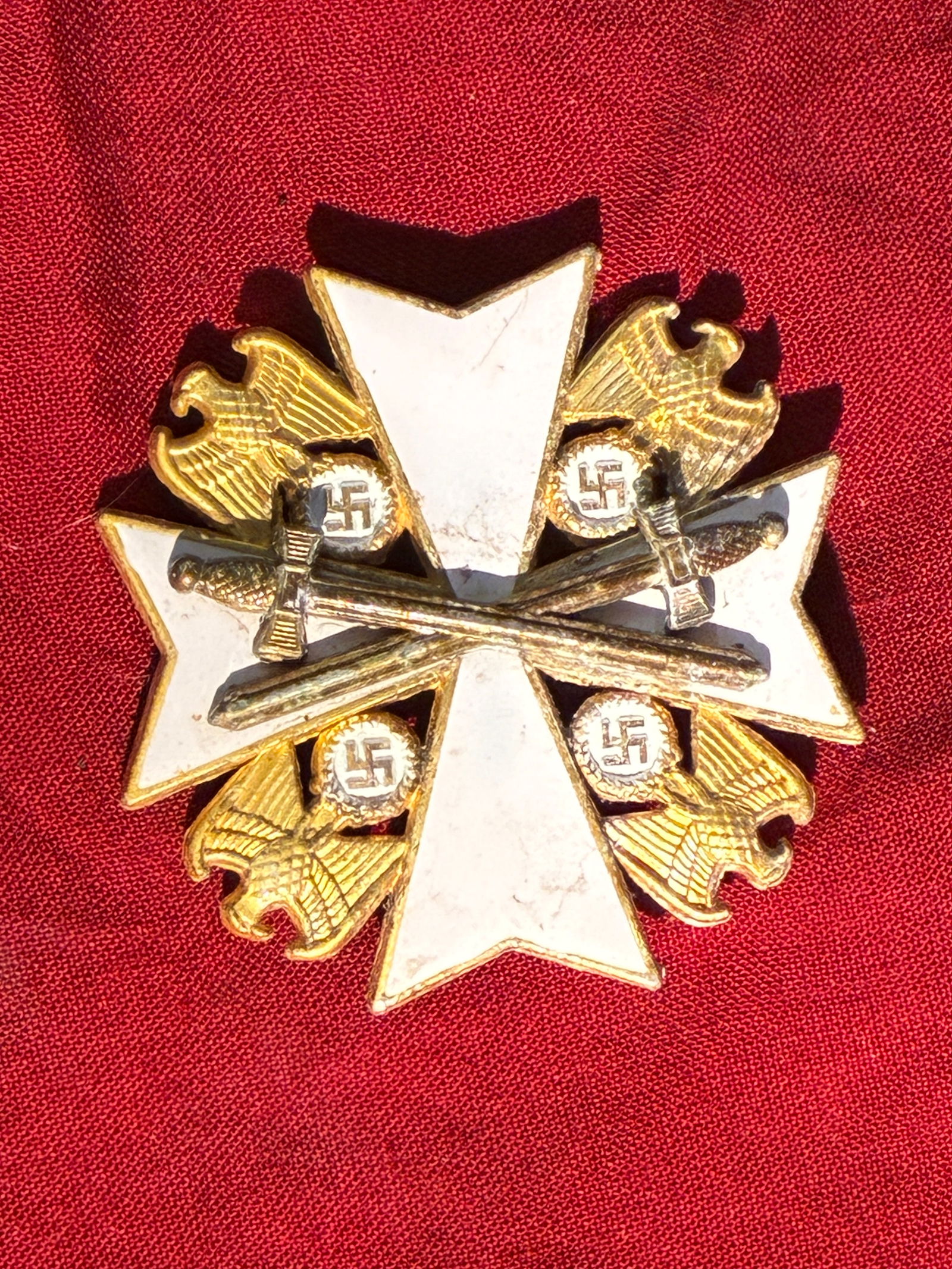 WW2 German Order (Deutscher Orden), Knight’s Cross with Swords — 900 Silver Marked: This object is a Knight’s Cross of the German Order, a decoration created by the Nazi regime and intended as one of its highest honors. The decoration features a white enamel Maltese cross backed by