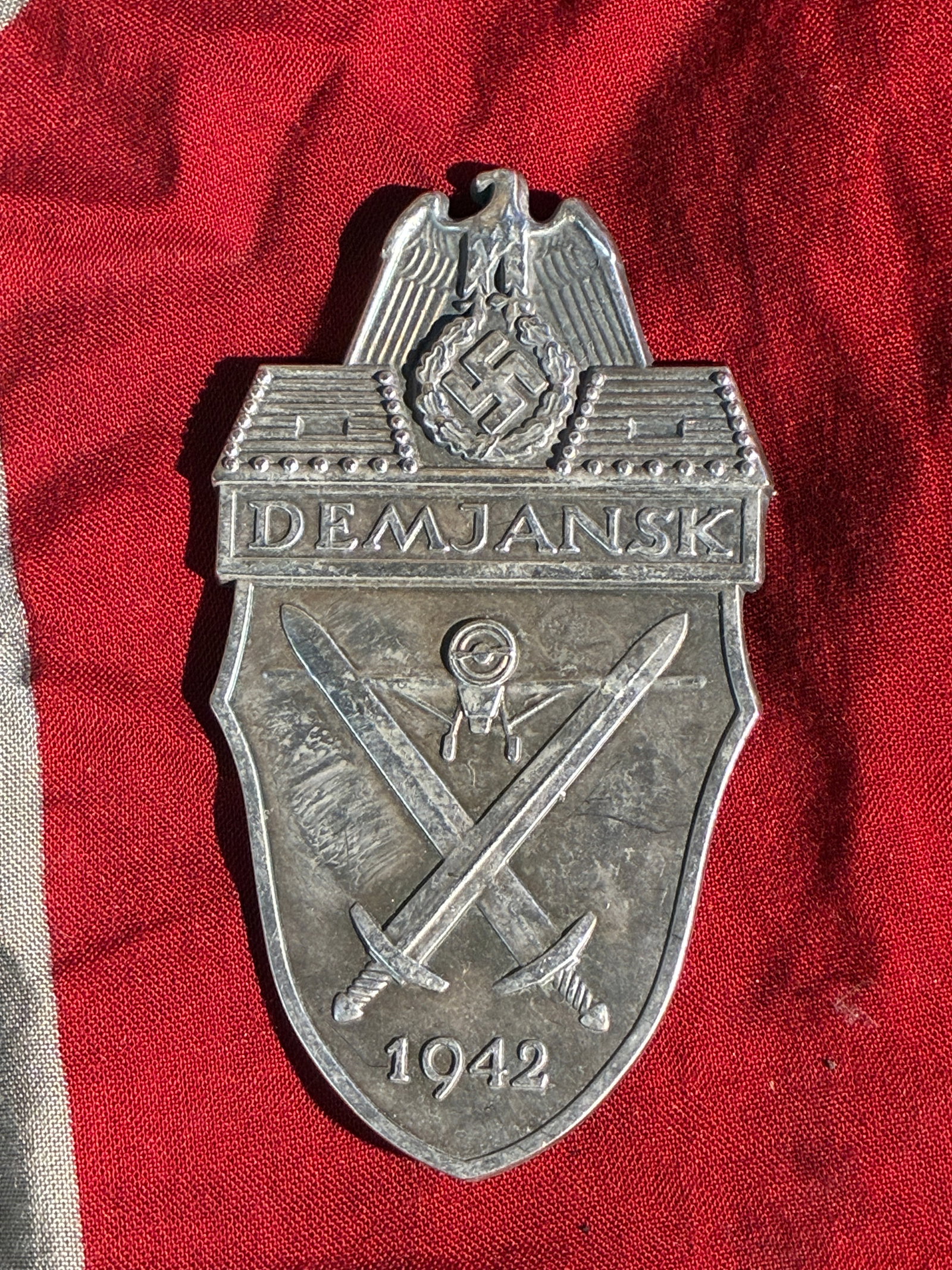 WW2 German Demjansk Shield (German Campaign Award, 1942): This metal shield is an original example of the Demjansk Shield, a German military campaign award created in 1942 for personnel who served in the Demjansk Pocket on the Eastern Front. Approved by the 