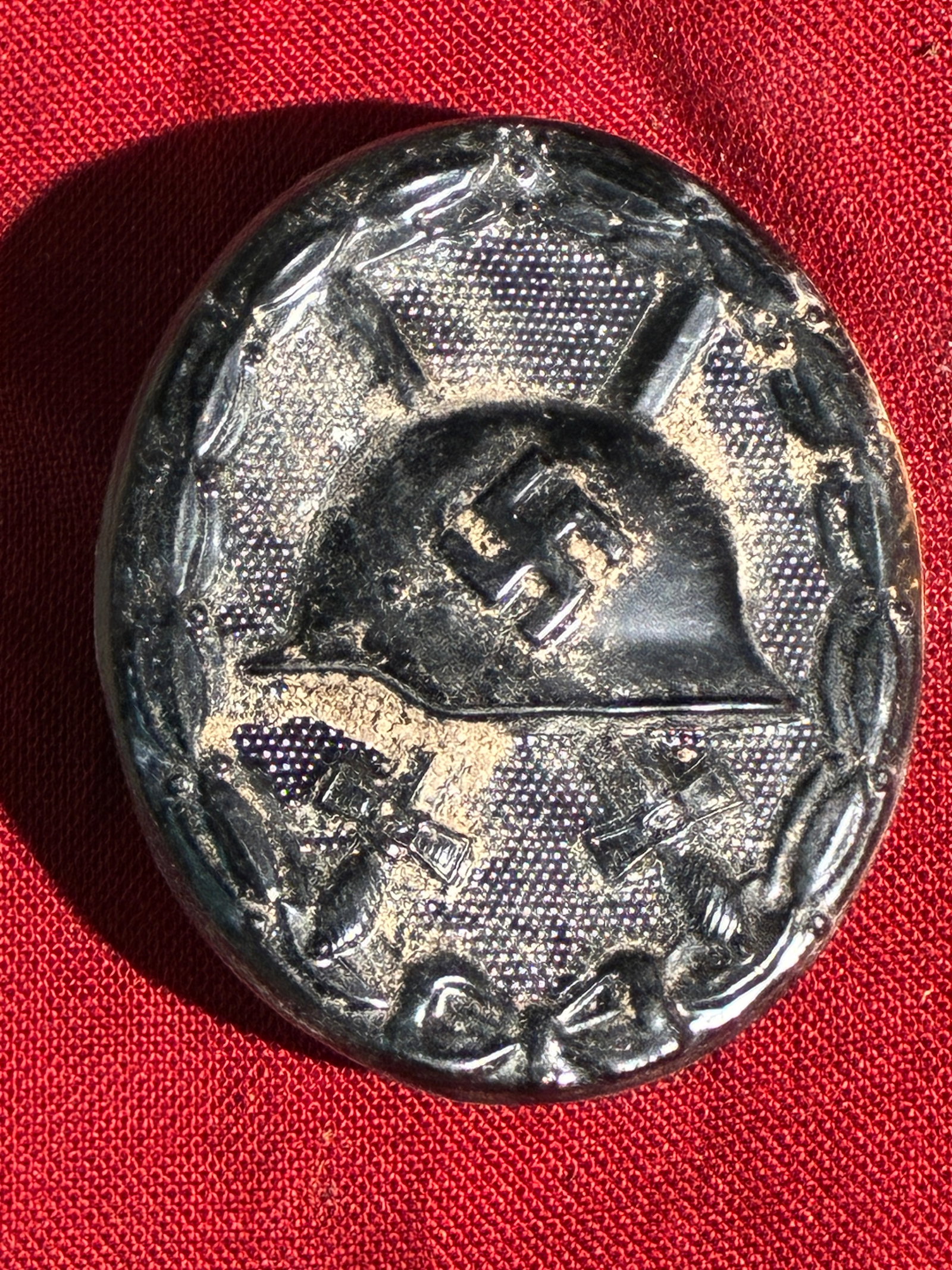 WW2 German Wound Badge (Black Grade), 1939 Issue Marked 30: This badge represents the Black Wound Badge, the lowest of three grades awarded in Nazi Germany to military personnel injured in combat. First introduced during World War I and reissued under the Thir