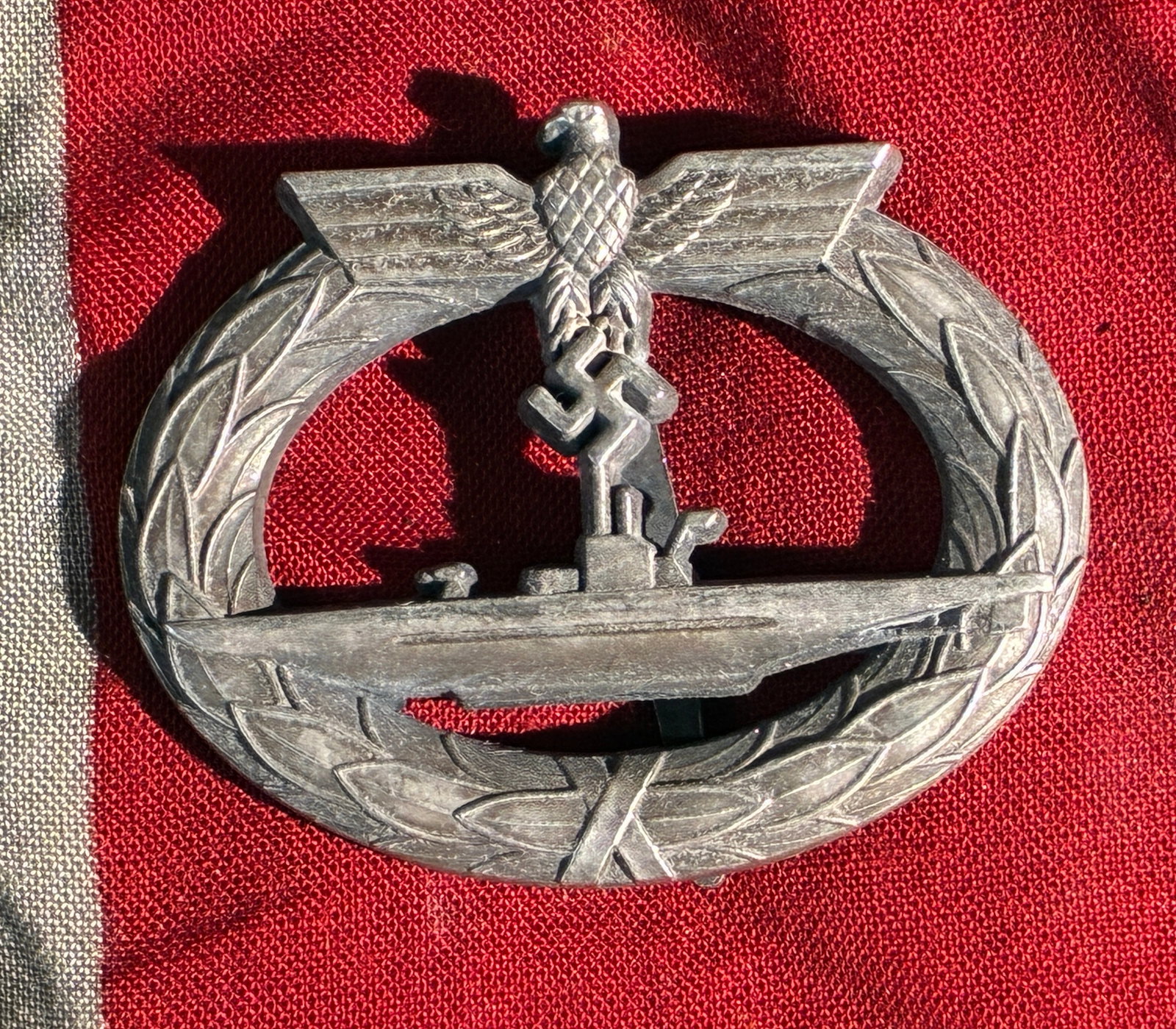 WW2 German Kriegsmarine U-Boat War Badge (Model 1939), Attributed to Schwerin, Berlin: This badge is a Kriegsmarine U-Boat War Badge, a military qualification insignia instituted by Nazi Germany in 1939 and awarded to U-boat crew members who had completed at least two war patrols or wer