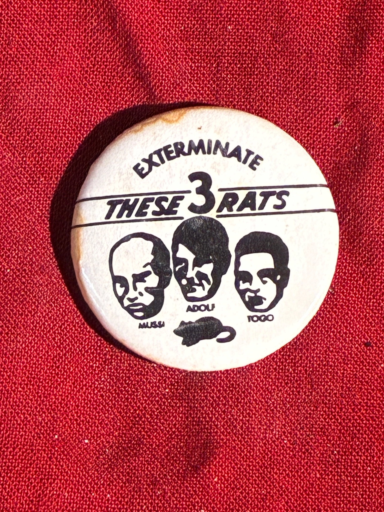 American WWII Anti-Axis Propaganda Button: “Exterminate These 3 Rats: This small celluloid pin-back button, produced in the United States during World War II, reflects the intense and often dehumanizing propaganda used on the home front to rally public support against t