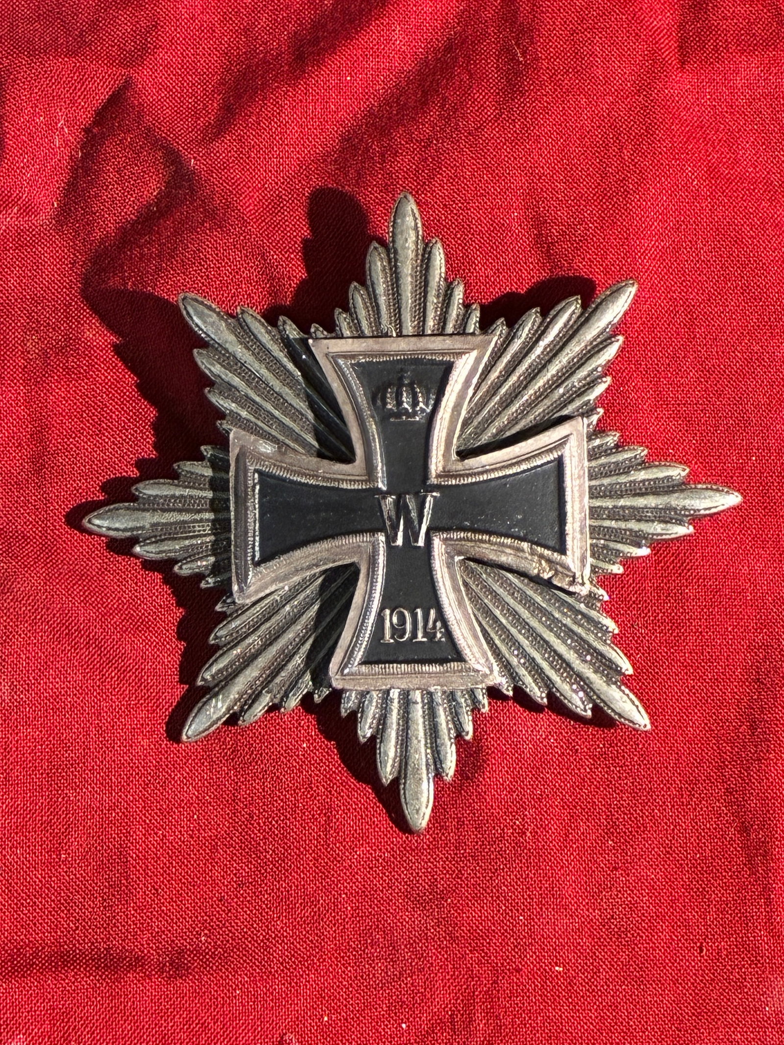 Prussian Iron Cross First Class with Star (World War I Commemorative Version), 1914: This striking insignia is a Prussian Iron Cross First Class mounted on an eight-pointed star, a form commonly produced as a veteran’s or commemorative badge following the First World War. The centra