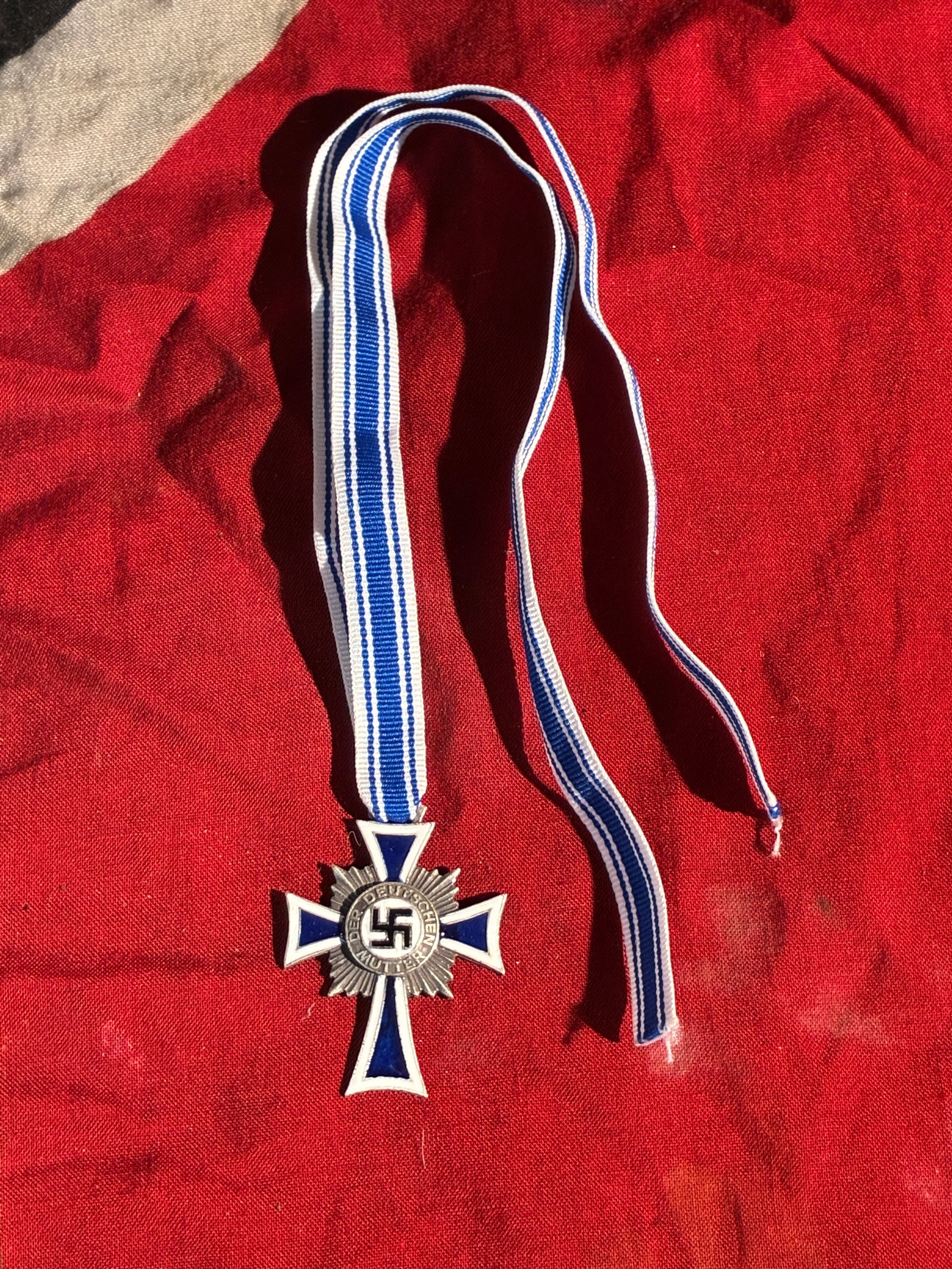 WW2 German Cross of Honour of the German Mother (Mutterkreuz), Gold Class – 1938 Presentation: This medal is an example of the Cross of Honour of the German Mother, a state decoration awarded in Nazi Germany beginning in 1939. Instituted by Adolf Hitler, the award was designed to promote large 