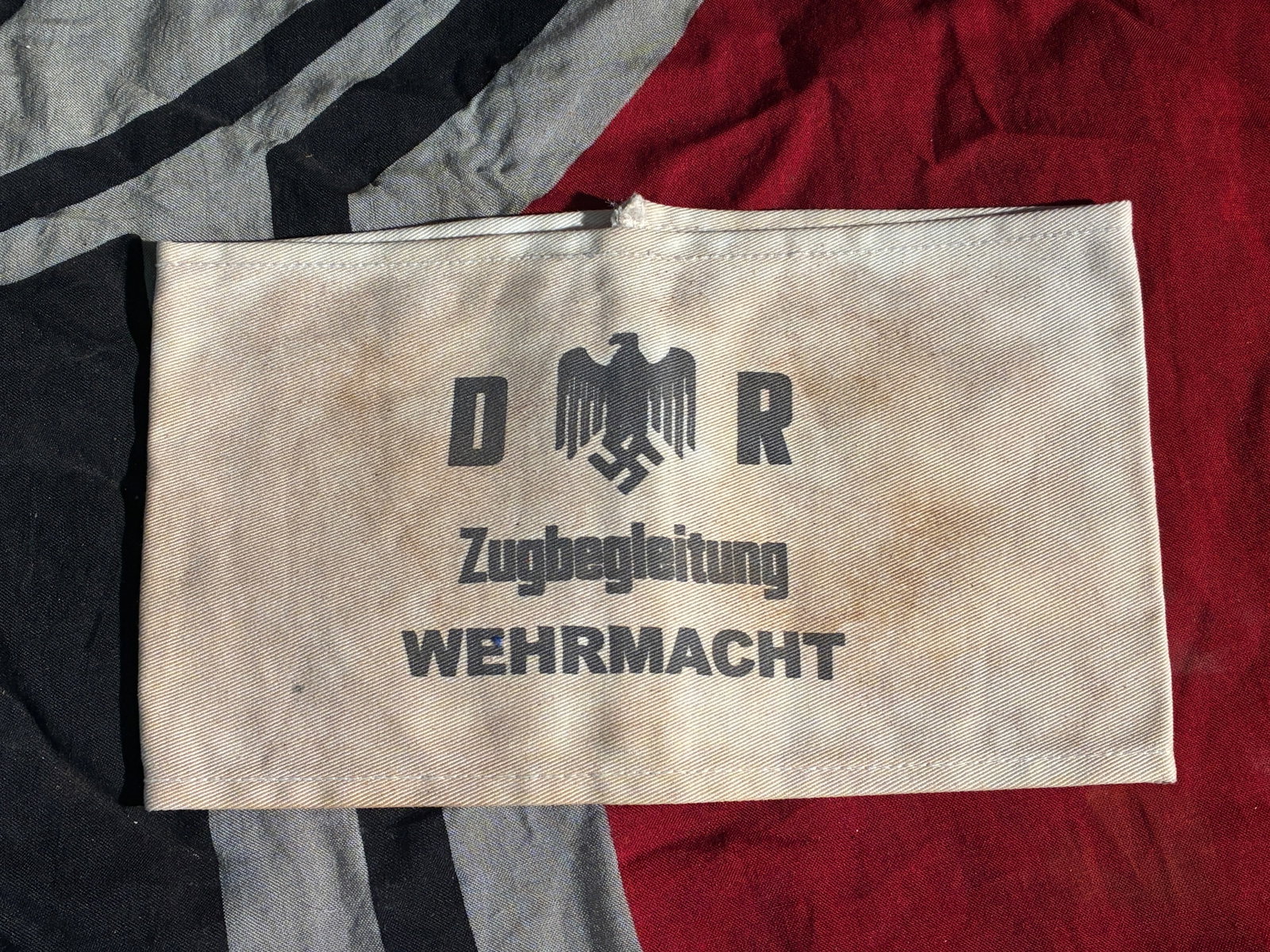 WW2 German Wehrmacht Train Escort Armband (Zugbegleitung), ca. 1939–1945: This armband, printed with the words “Zugbegleitung WEHRMACHT” (“Train Escort – Armed Forces”), was worn by designated German military personnel assigned to escort, guard, or supervi