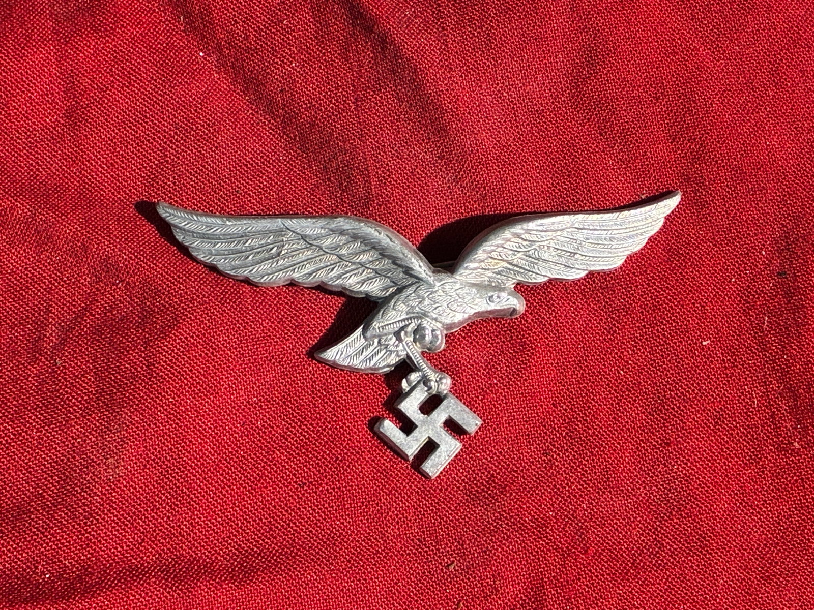 WW2 German Luftwaffe Enlisted/NCO Cap Eagle Insignia (1935–1945): This aluminum cap eagle is an original-pattern insignia worn by enlisted men and non-commissioned officers of the German Luftwaffe during the Second World War. Designed in the distinctive Luftwaffe st
