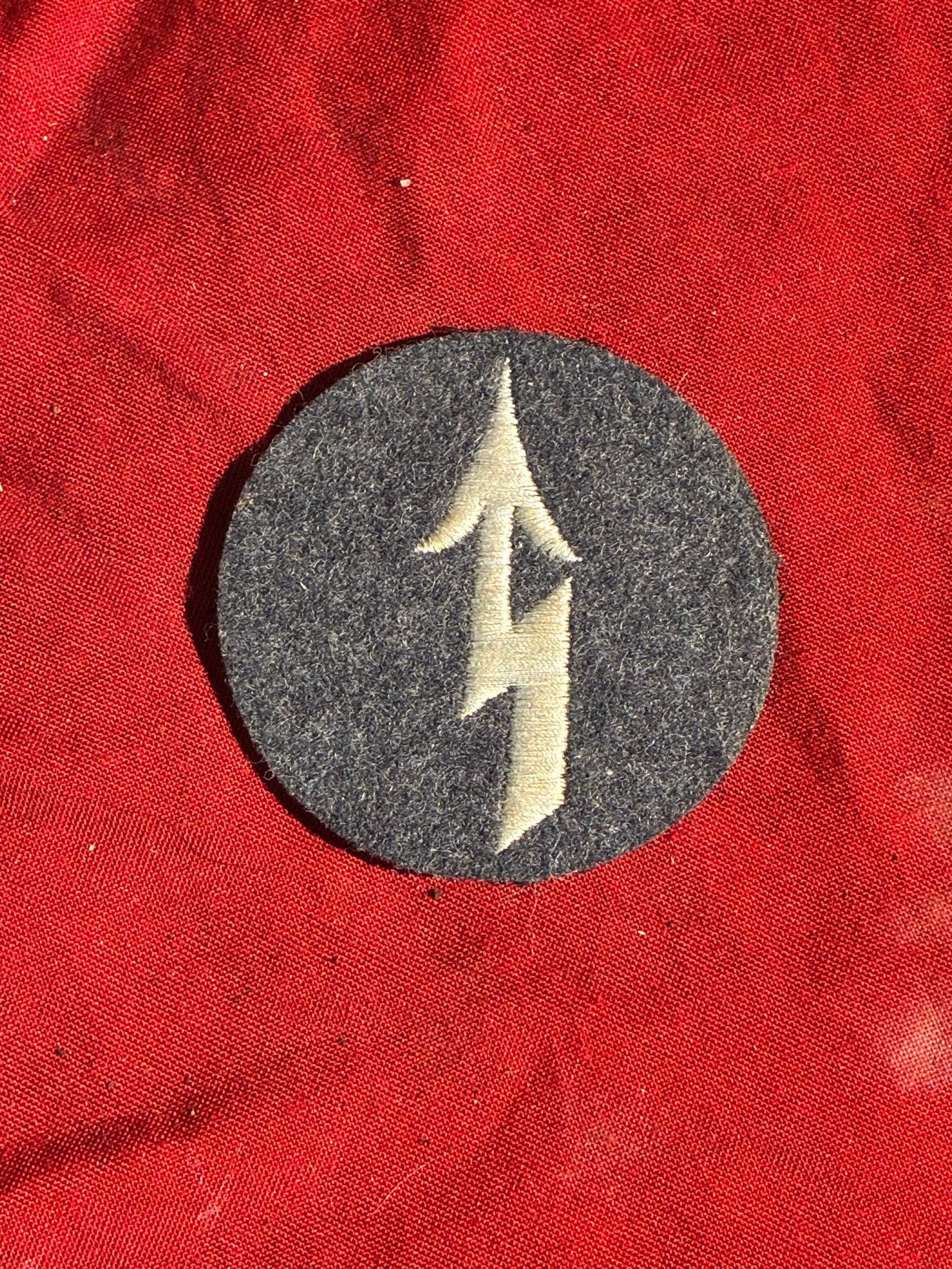 WW2 German Signals Specialist Sleeve Insignia – Wehrmacht Communications Troops (Germany, ca.: This circular cloth insignia was worn by German Wehrmacht Nachrichtentruppe (signals troops), the soldiers responsible for military communications during the Second World War. The patch features a sha