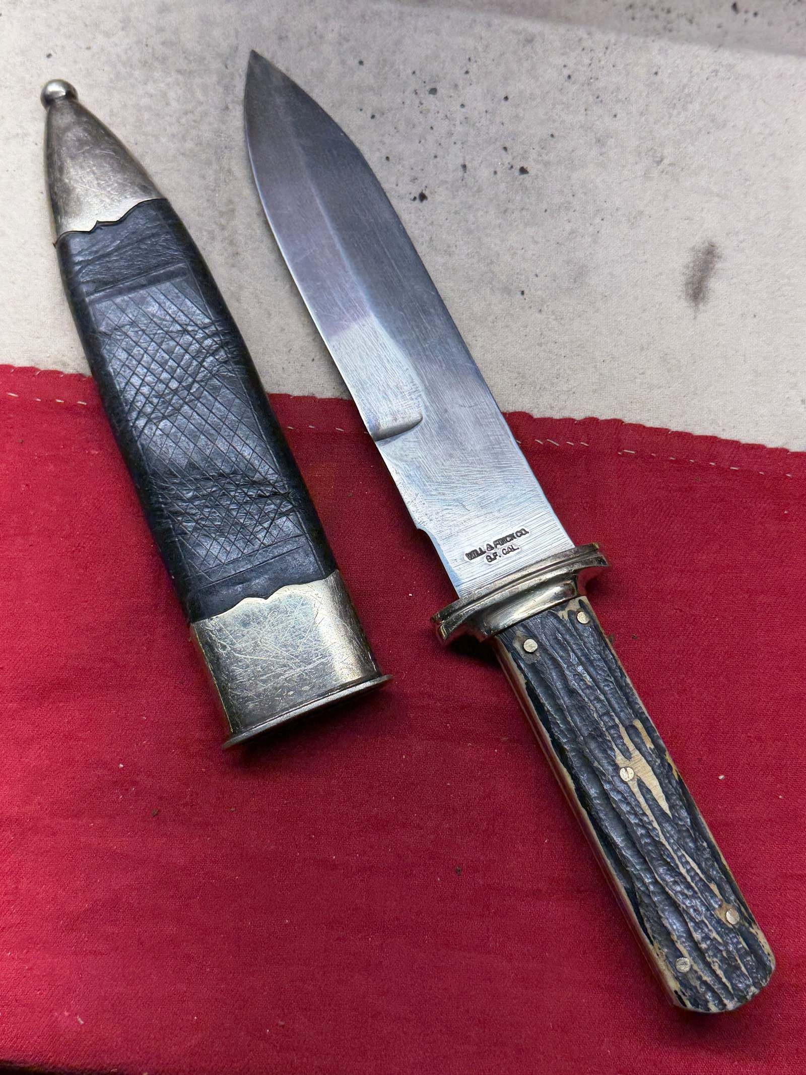 1800's Will & Finck Sporting Knife with Original Leather-and-Silver Scabbard: This fixed-blade sporting knife was produced by the renowned Will & Finck Company of San Francisco, one of the most celebrated cutlery and tool manufacturers of the American West. The blade bears the 