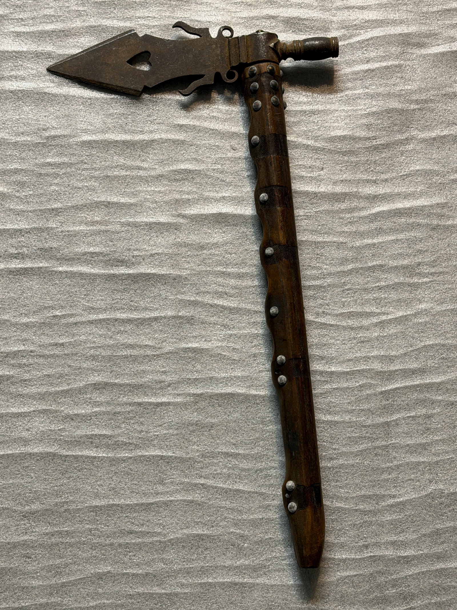 Native American Iindians Frontier Heart-Blade Combination Tomahawk, ca. Late 19th C.: This unusual heart-cut steel tomahawk represents a later, decorative interpretation of the iconic Native American trade axe. Measuring approximately 20 inches in length, the piece combines a stylized 