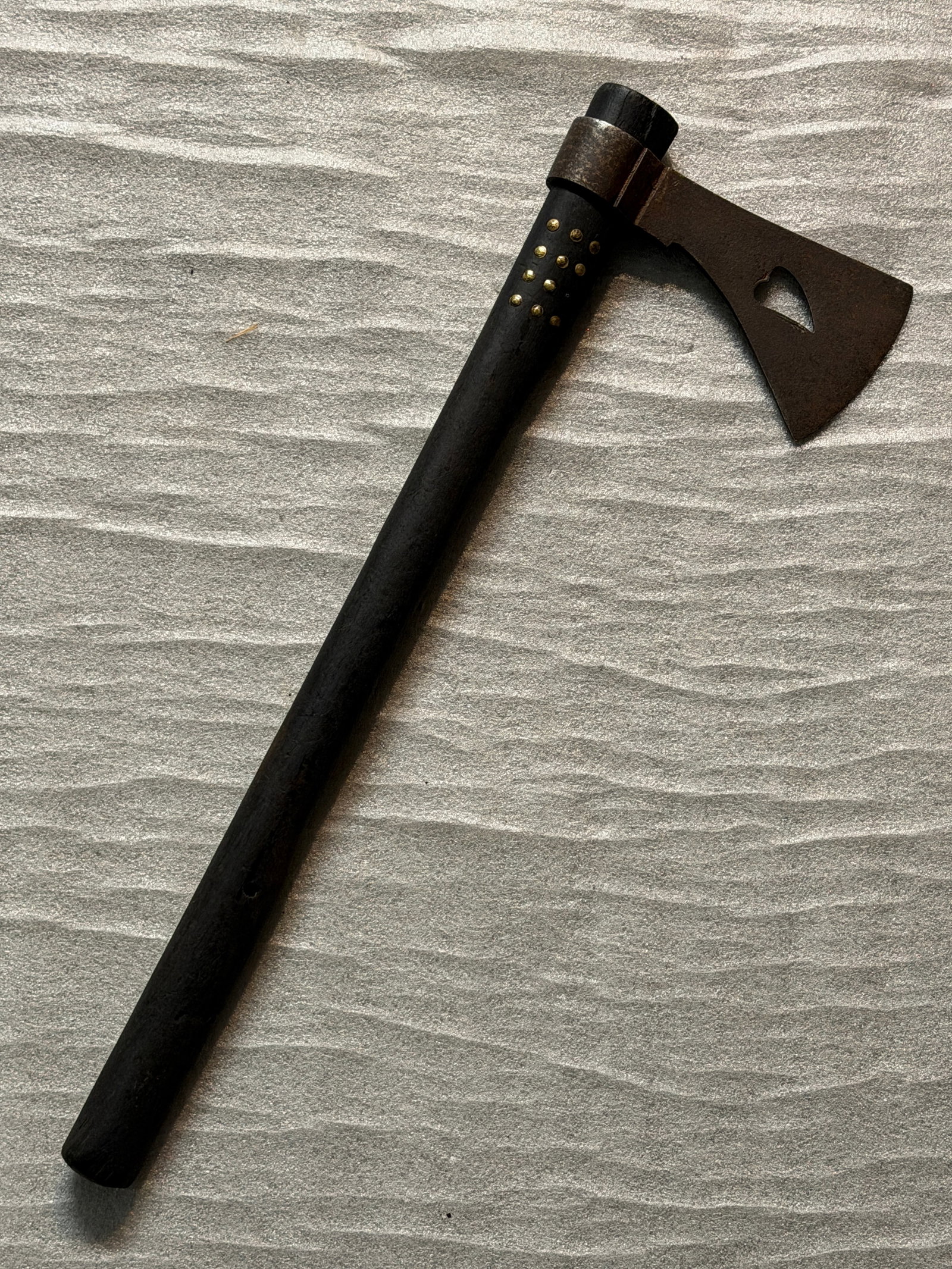 Native Americn Plains Indians Trade Tomahawk with Heart-Cut Blade, ca. 1850–1880: This finely balanced Plains trade tomahawk represents the blending of Native craftsmanship and Euro-American metalworking during the mid- to late 19th century. Widely exchanged across the Northern Pla