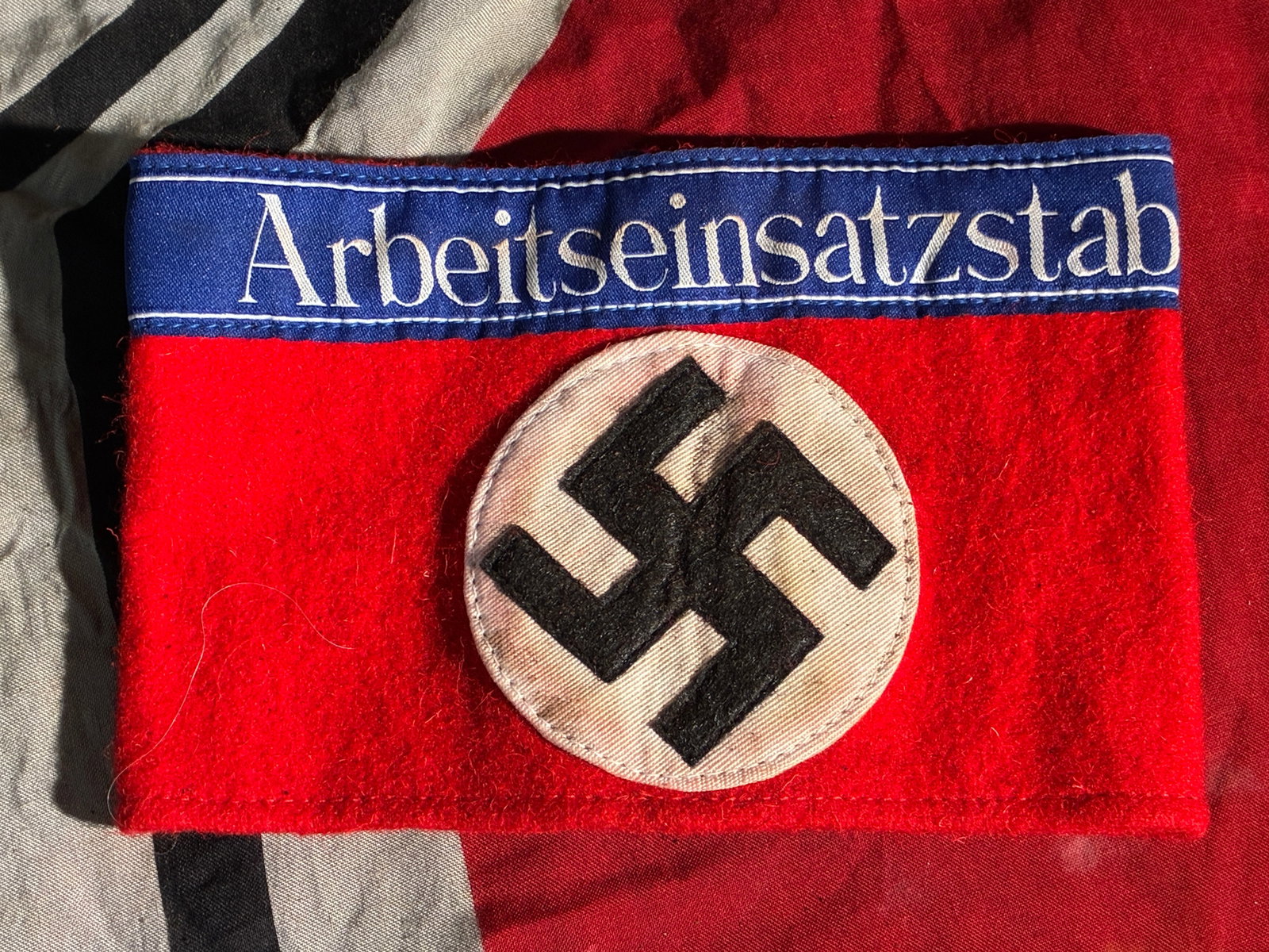 WW2 German Arbeitseinsatzstab Armband (Forced-Labor Administration): This armband, marked “Arbeitseinsatzstab” (“Labor Deployment Staff”), is an artifact from Nazi Germany’s forced-labor administration during the Second World War. Worn by personnel ta