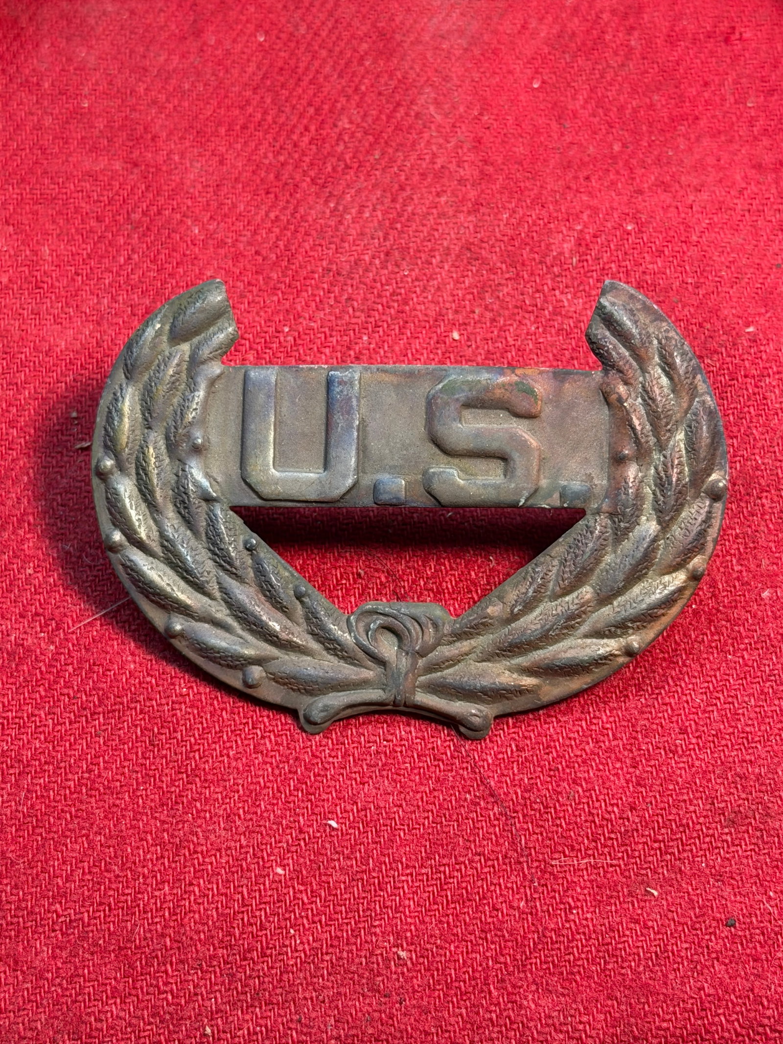 Civil War U.S. Staff Officer’s Wreath Insignia: This brass U.S. staff officer’s wreath insignia dates to the American Civil War (1861–1865) and would have been worn on a kepi or forage cap by Union Army officers serving in administrative, staff