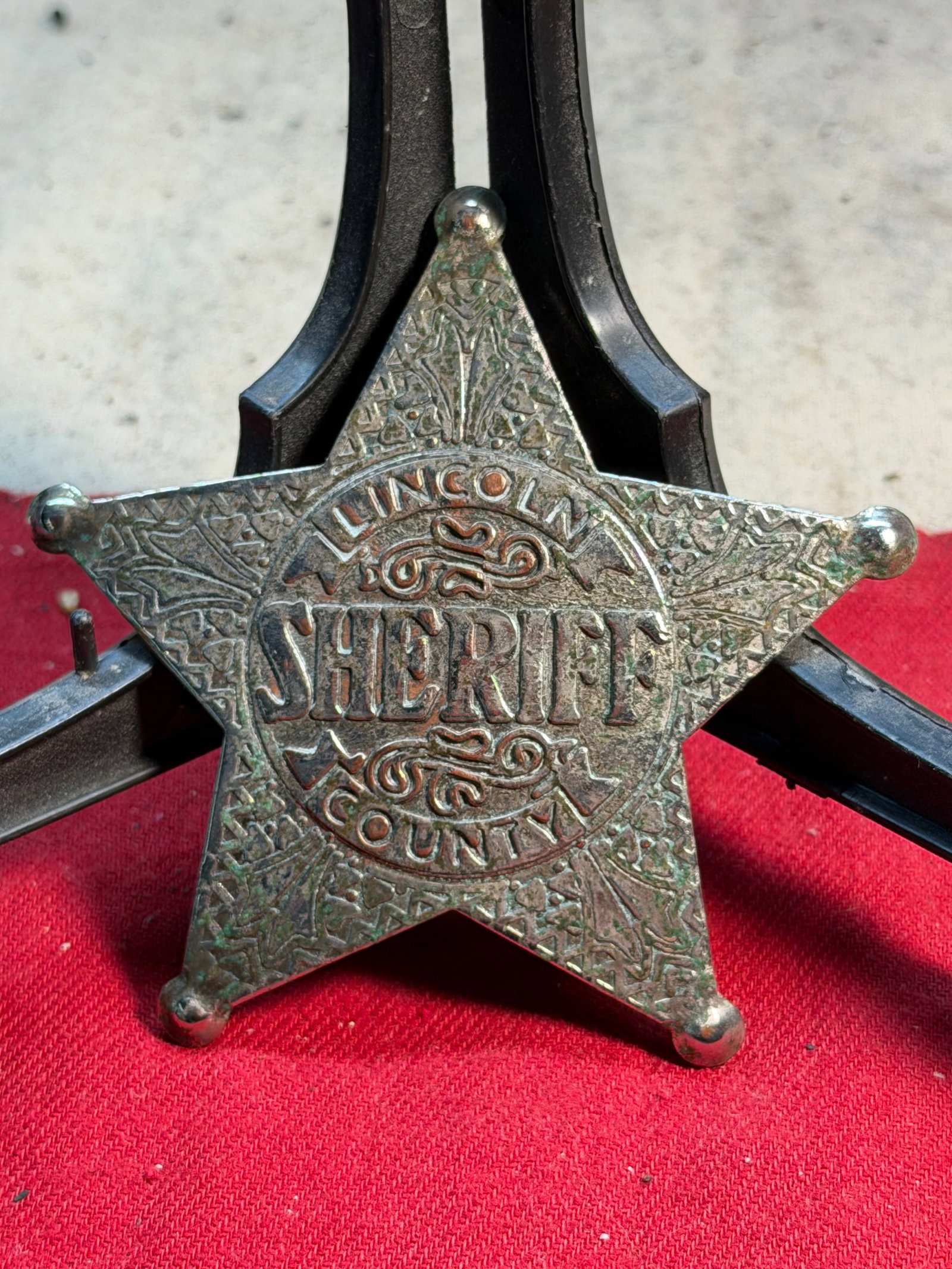 Lincoln County Sheriff Badge — Late 19th to Early 20th Century: This five-point “ball-tip” star badge, inscribed “LINCOLN COUNTY SHERIFF,” reflects the classic style of American frontier and early county law-enforcement insignia. Cast in metal with