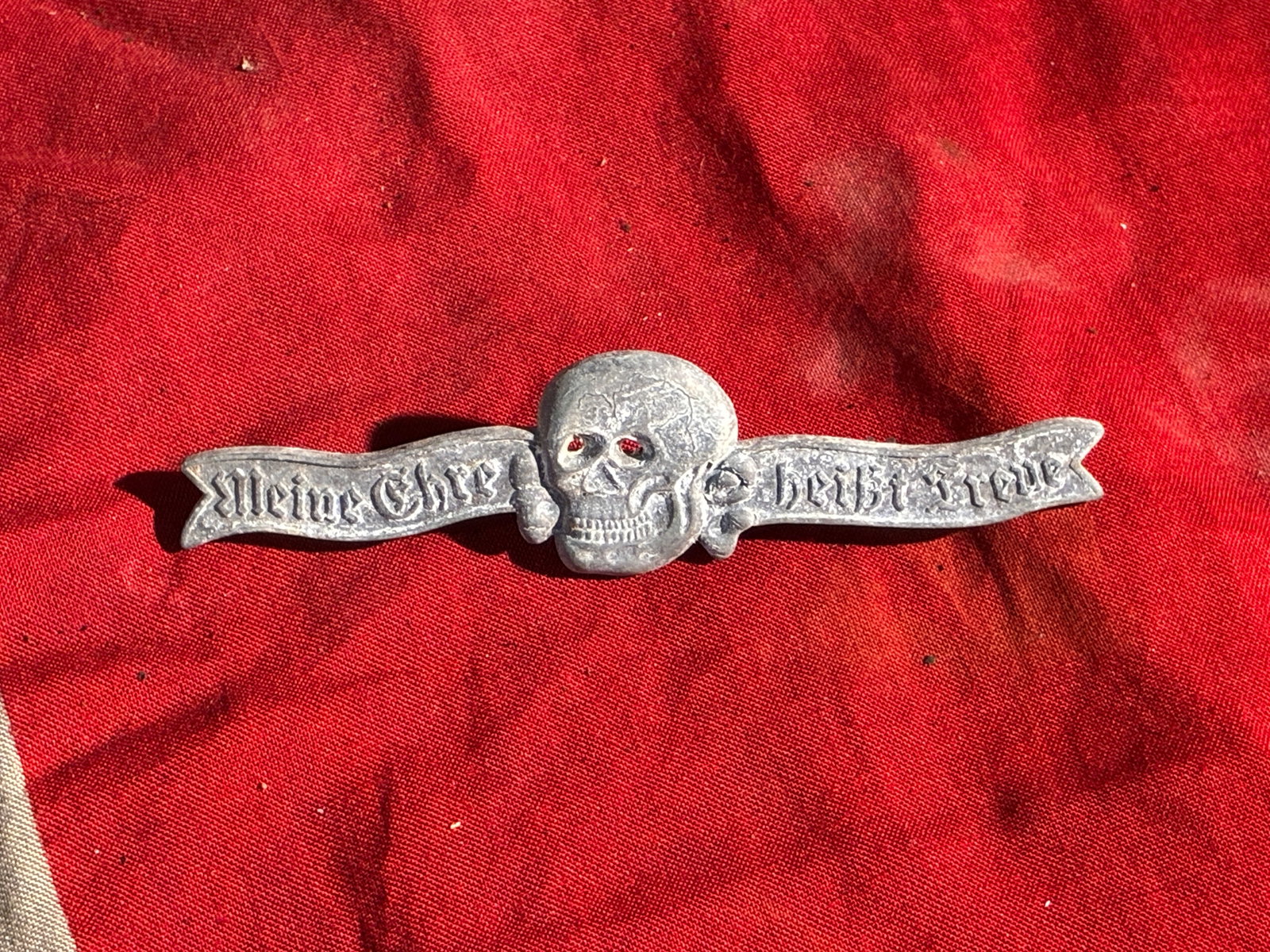 WW2 German “Meine Ehre heißt Treue?? SS Motto Brooch Badge By RZM M1/34: This brooch features the slogan “Meine Ehre heißt Treue” (“My Honor Is Loyalty”), the official motto of the Schutzstaffel (SS), an elite paramilitary organization of the Nazi regime r