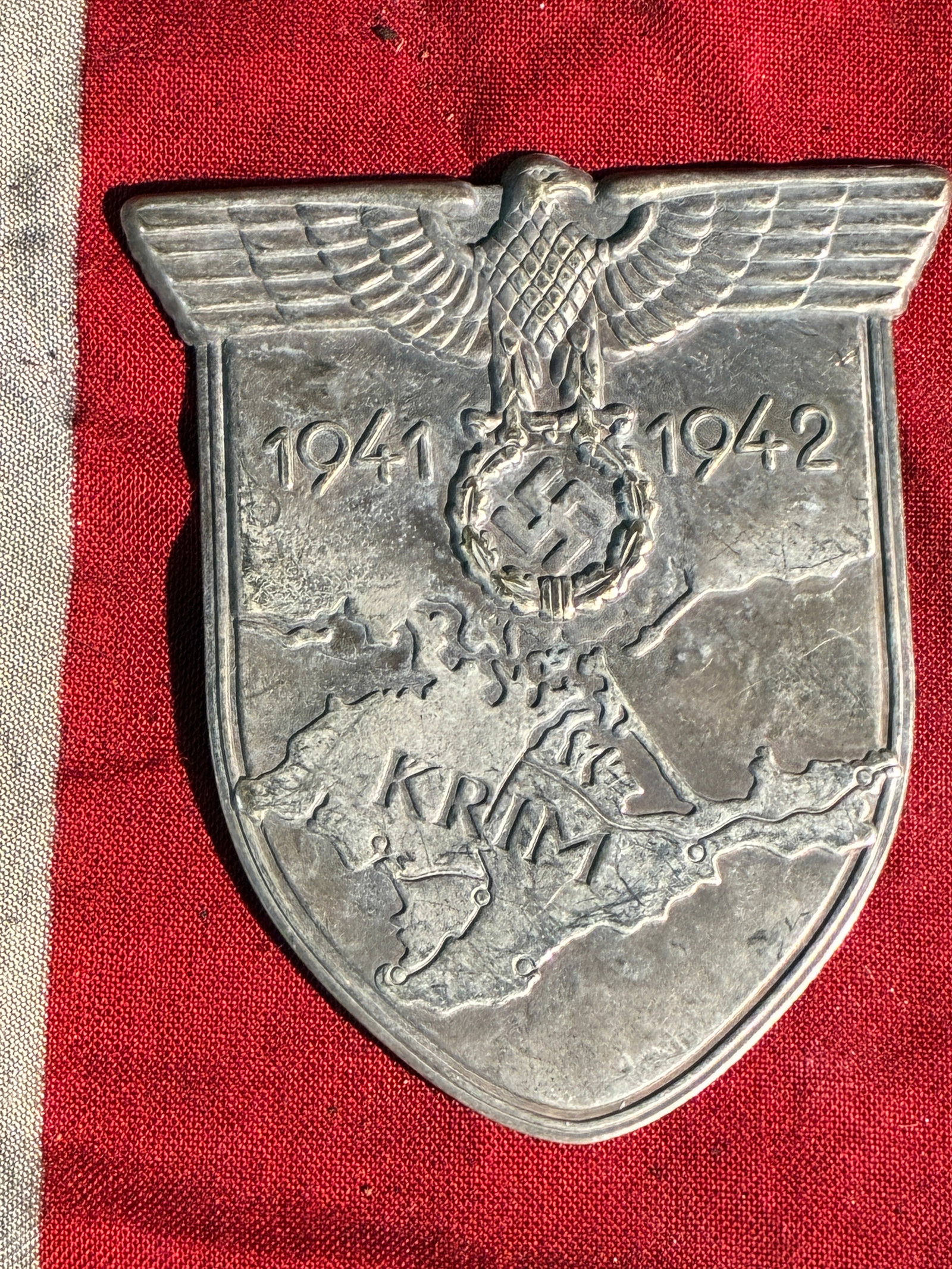 WW2 German Krim Shield (Crimea Campaign Badge), 1941–1942: This metal campaign shield, known as the Krim Shield, was issued by Nazi Germany to soldiers who participated in the Wehrmacht and Luftwaffe operations in the Crimean Peninsula between September 1941 