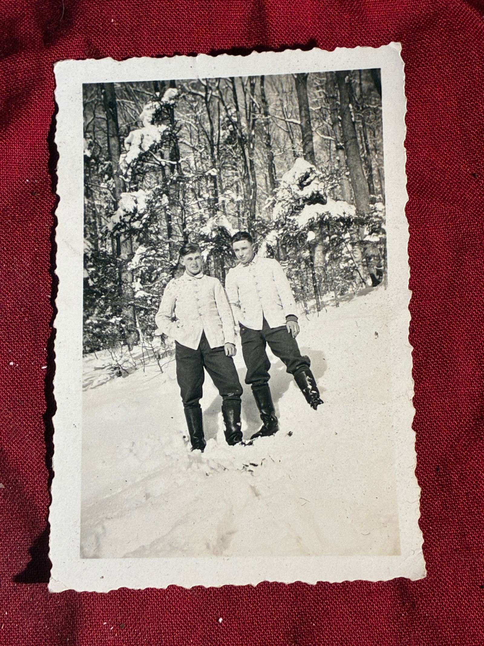 WW2 German Winter Uniform Portrait of Two German Soldiers (c. 1939–1945): This photograph captures two German soldiers standing in deep winter snow, likely during training or deployment on the Eastern Front sometime between 1939 and 1945. Both men wear regulation cold-weath