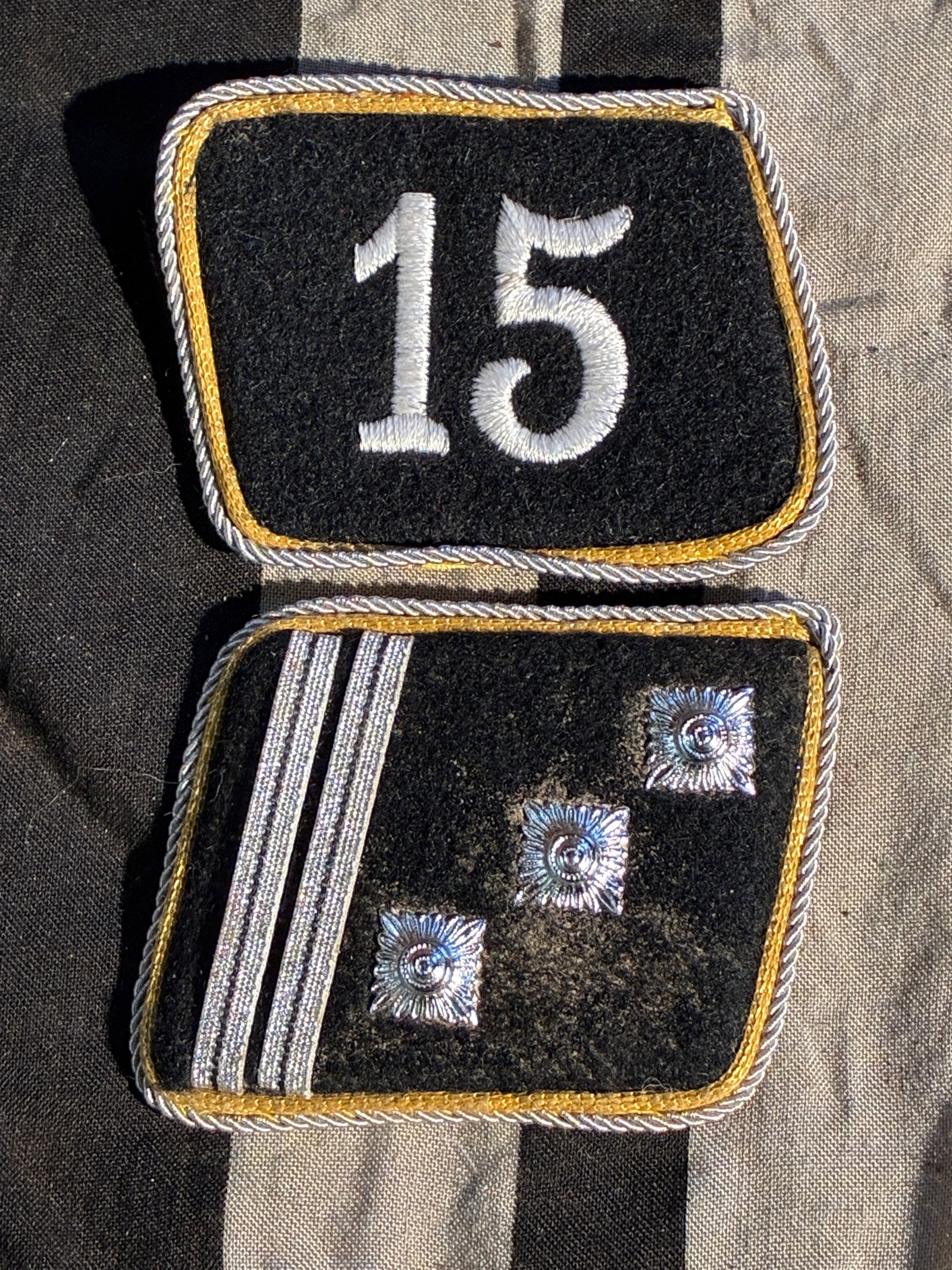 WW2 German NSDAP Political Leader Collar Tabs (Ortsgruppenleiter Rank), Set “15?? With RZM Tag: This pair of collar tabs belonged to a mid-level political leader of the National Socialist German Workers’ Party (NSDAP) during the Third Reich. The set consists of a right-hand number tab bearing 