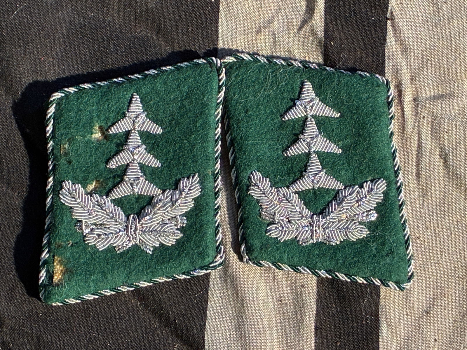 WW2 German Forestry Service Senior Official Collar Tabs (Reichsforstamt), ca. 1930s–1945: These matching collar tabs belonged to a senior official of the German Forestry Service (Reichsforstamt) during the era of the Third Reich. The dark-green wool tabs feature hand-embroidered silver bul