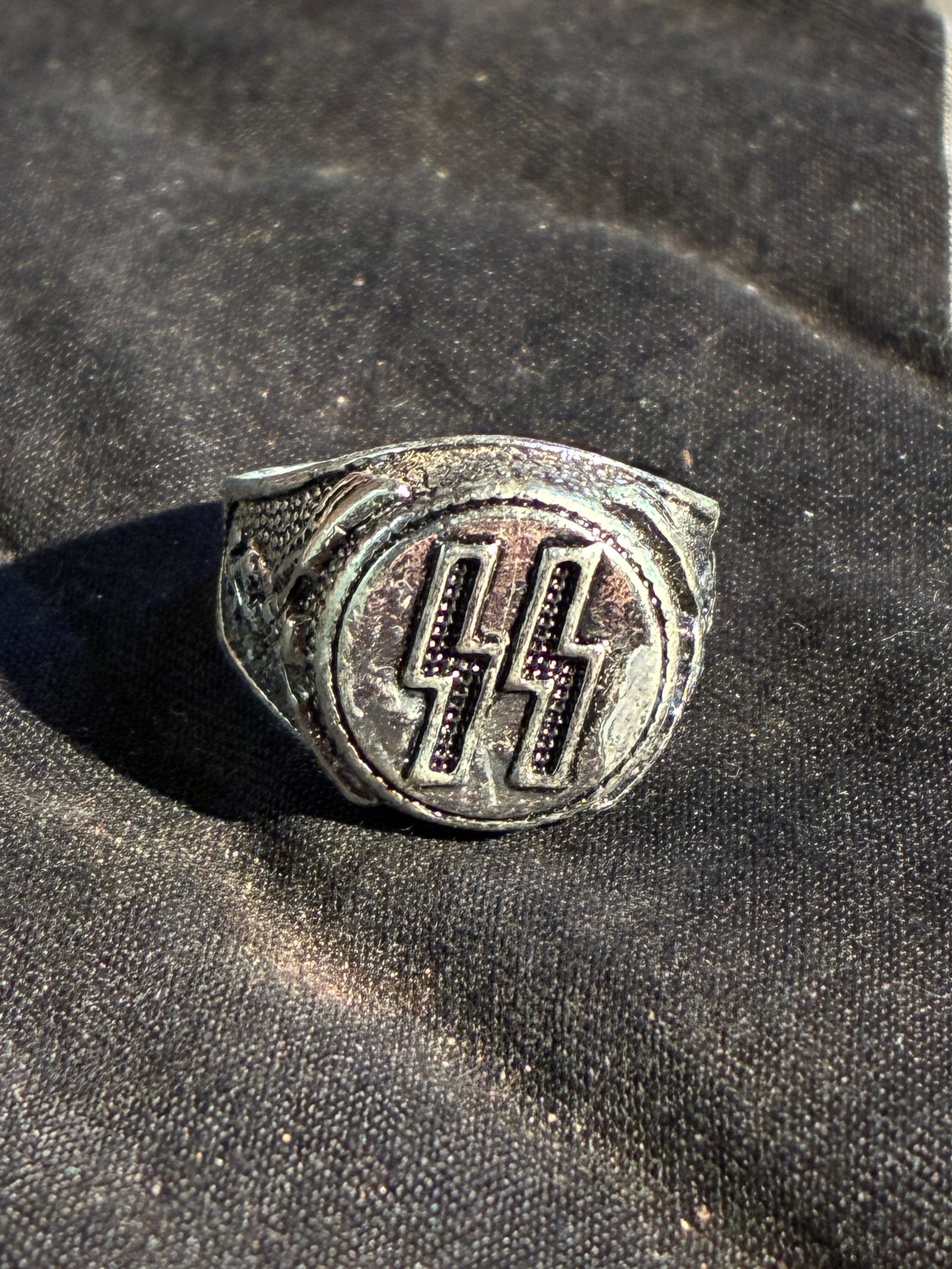 SCARCE WW2 GERMAN WAFFEN SS OFFICER SILVER RING: SCARCE WW2 GERMAN WAFFEN SS OFFICER SILVER RING. A RARE FIND. SHOWS GOOD WEAR AND USE WITH A BEAUTIFUL OVERALL PATINA. PLEASE VIEW ALL DETAILED PICTURES. A RARE EXAMPLE OF THE TIME PERIOD.