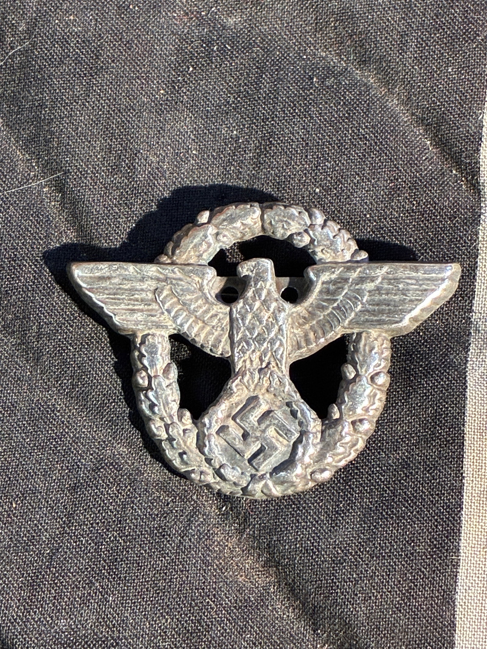 WW2 German National Eagle Cap Insignia (Verified Period Variant), c. 1930s–1940s: This metal cap badge is an authenticated variant of the national eagle insignia worn on headgear by several organizations in Nazi Germany during the 1930s and 1940s. The design features the German imp