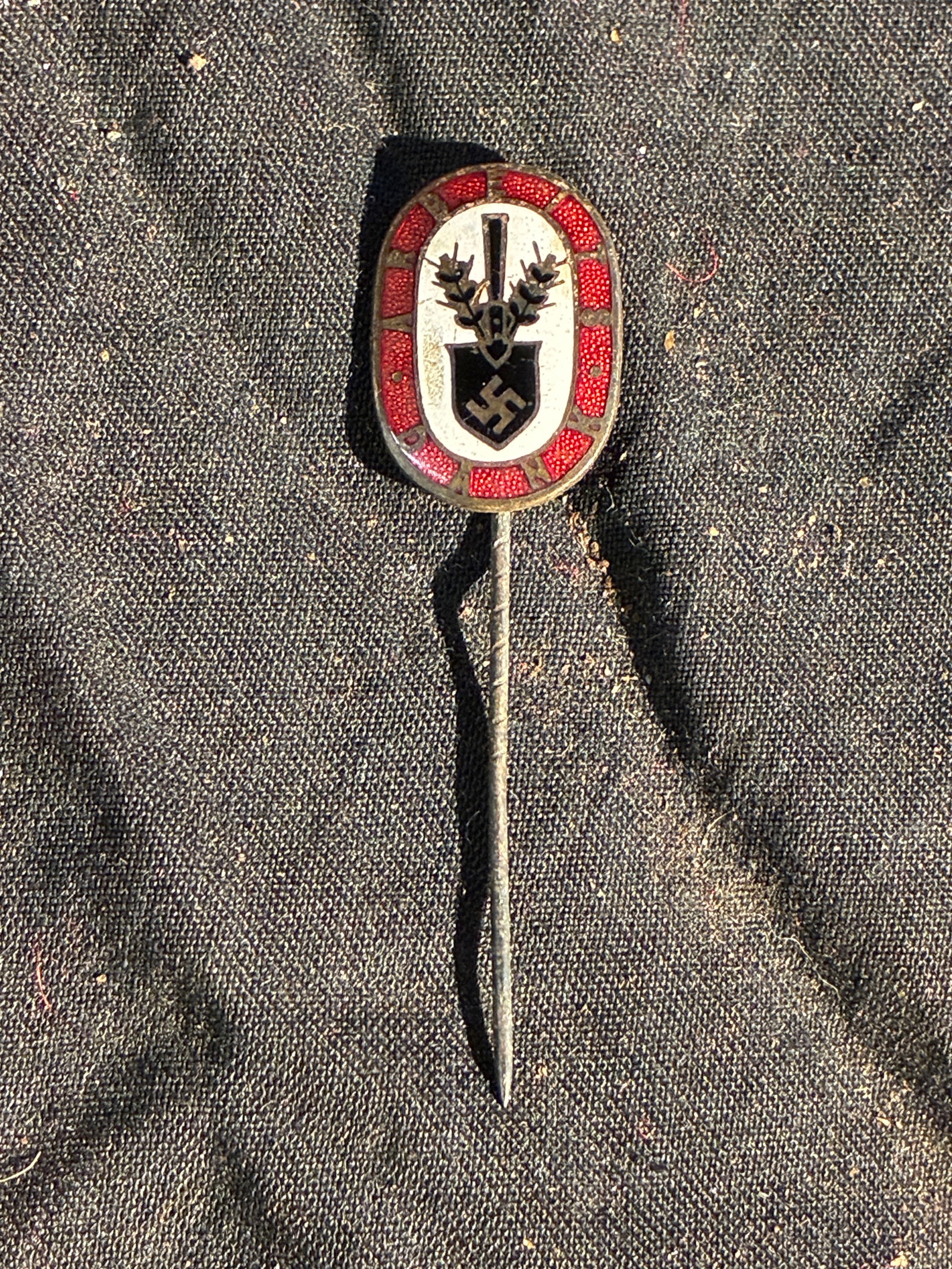 WW2 German Reichsnährstand / Agricultural League Commemorative Stickpin (c. 1933–1945): This small enamel stickpin was produced for members or supporters of the Reichsnährstand—the National Socialist agricultural organization responsible for overseeing farming, food production, and ru