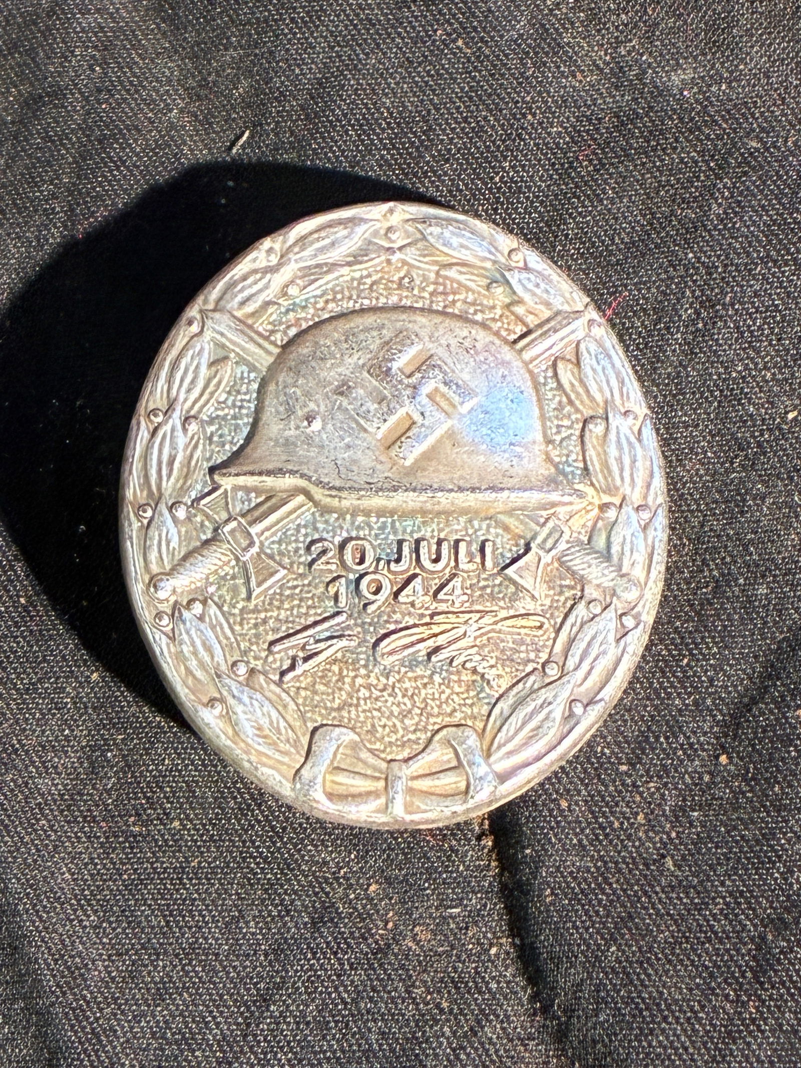 WW2 German “20. Juli 1944?? Silver Wound Badge In 800 Silver: This silver badge was created to honor those wounded during the 20 July 1944 attempt on Adolf Hitler’s life at the Führerhauptquartier “Wolfsschanze.” The design follows the traditional for